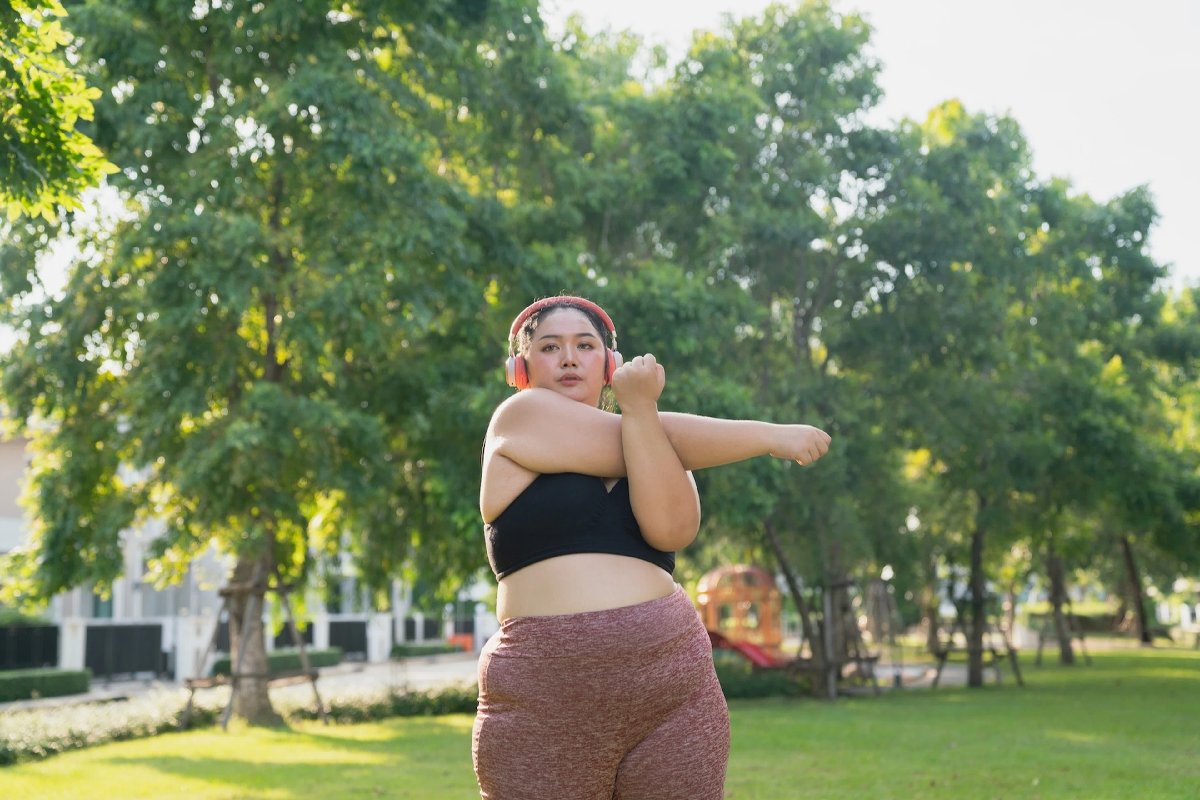 A runner stretching and locking in before an outdoor workout.