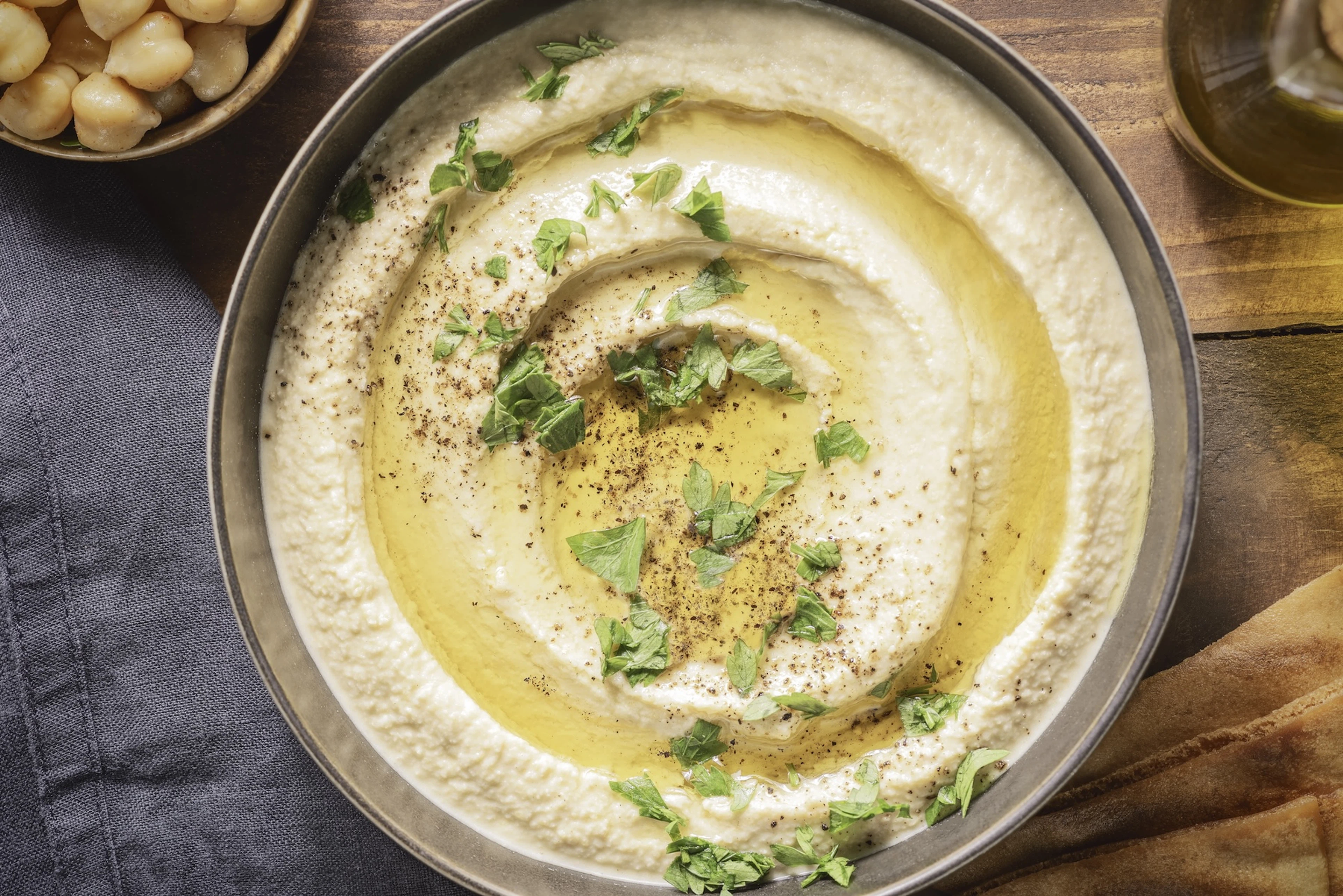 A bowl of creamy hummus.