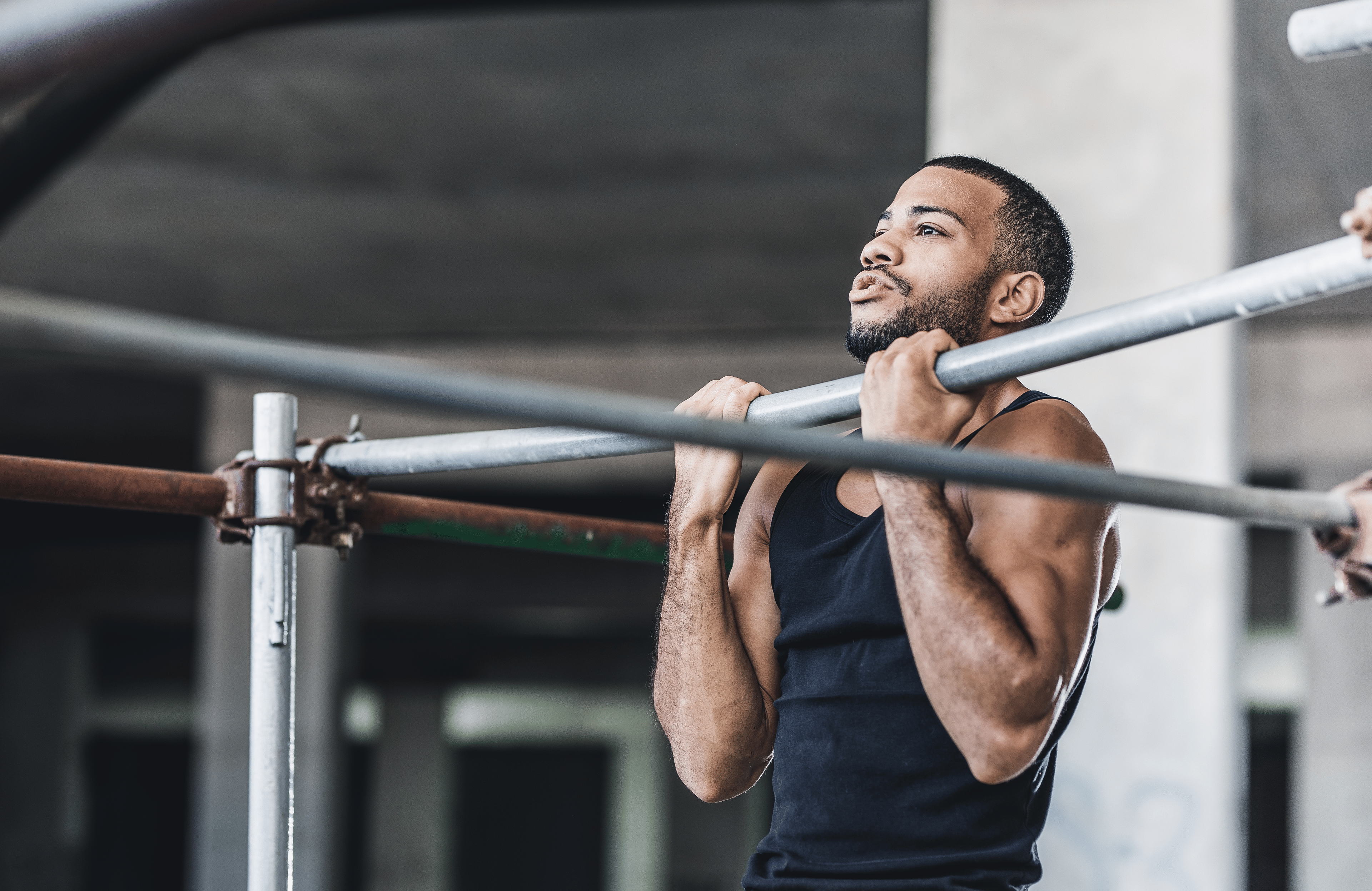 Man performing a reverse grip pull up exercise 