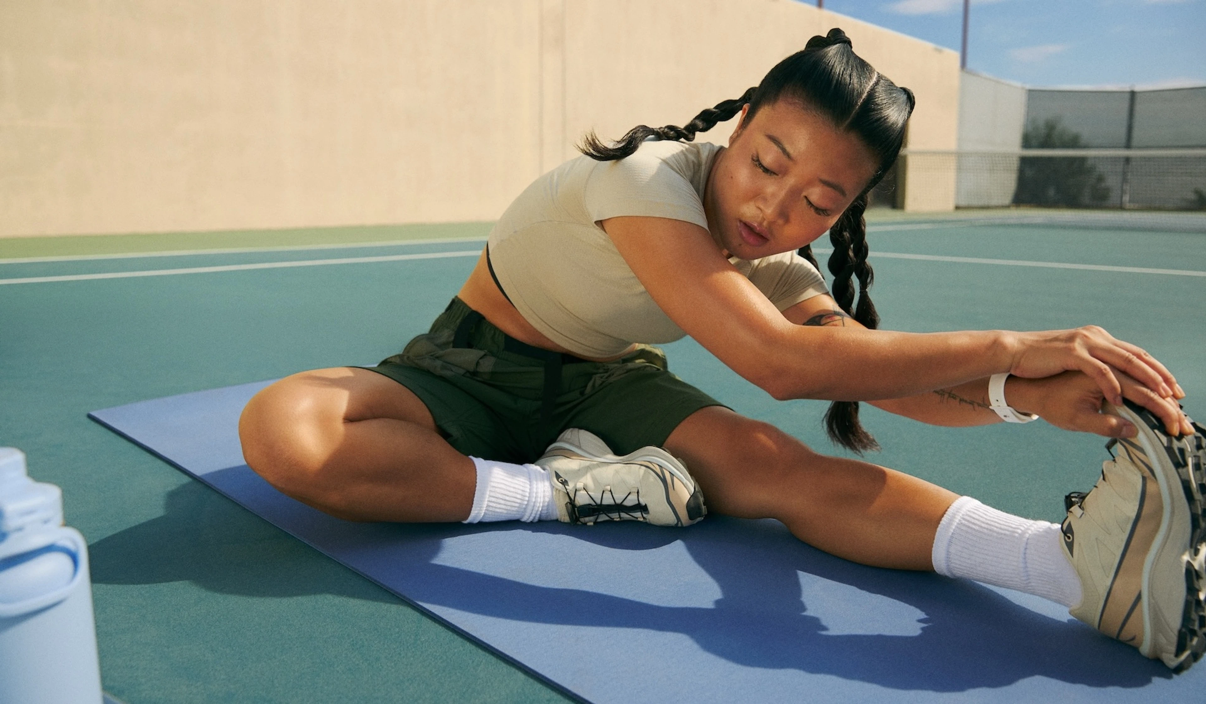 Woman doing stretching and mobility with the Peloton App after a workout