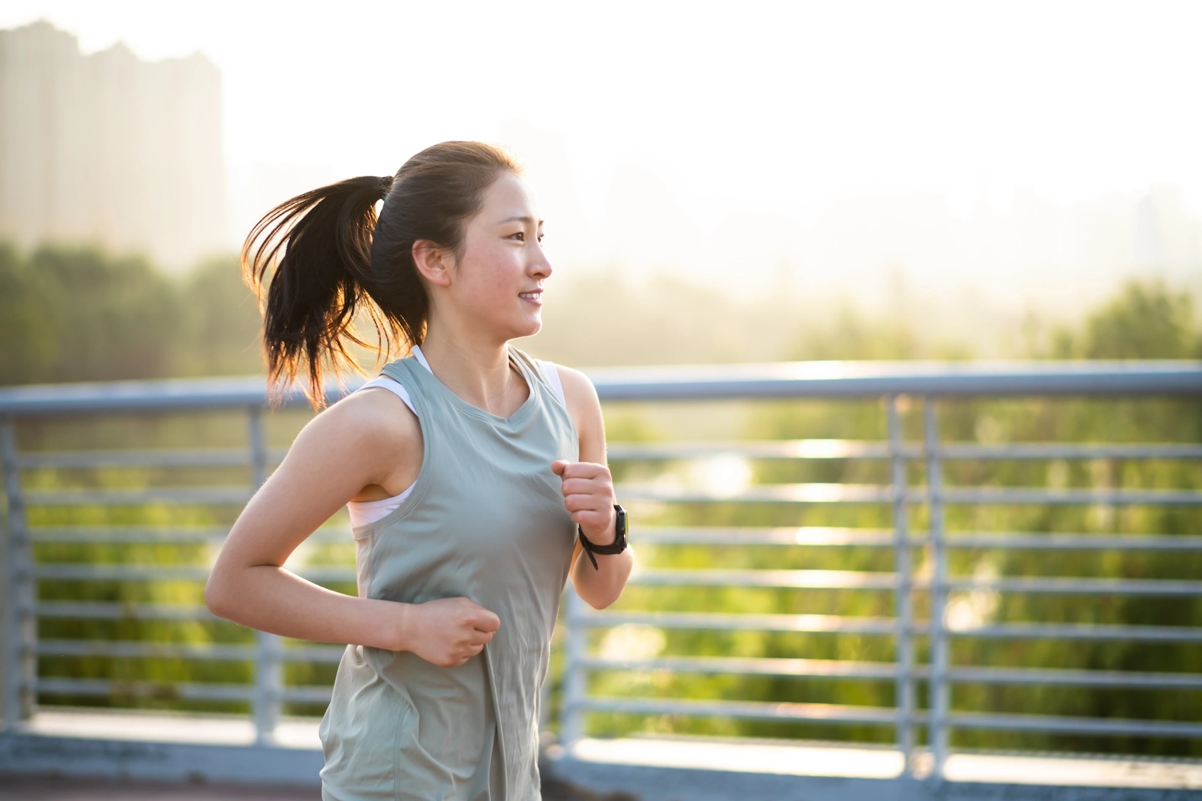 A woman going for a run in the morning outside.