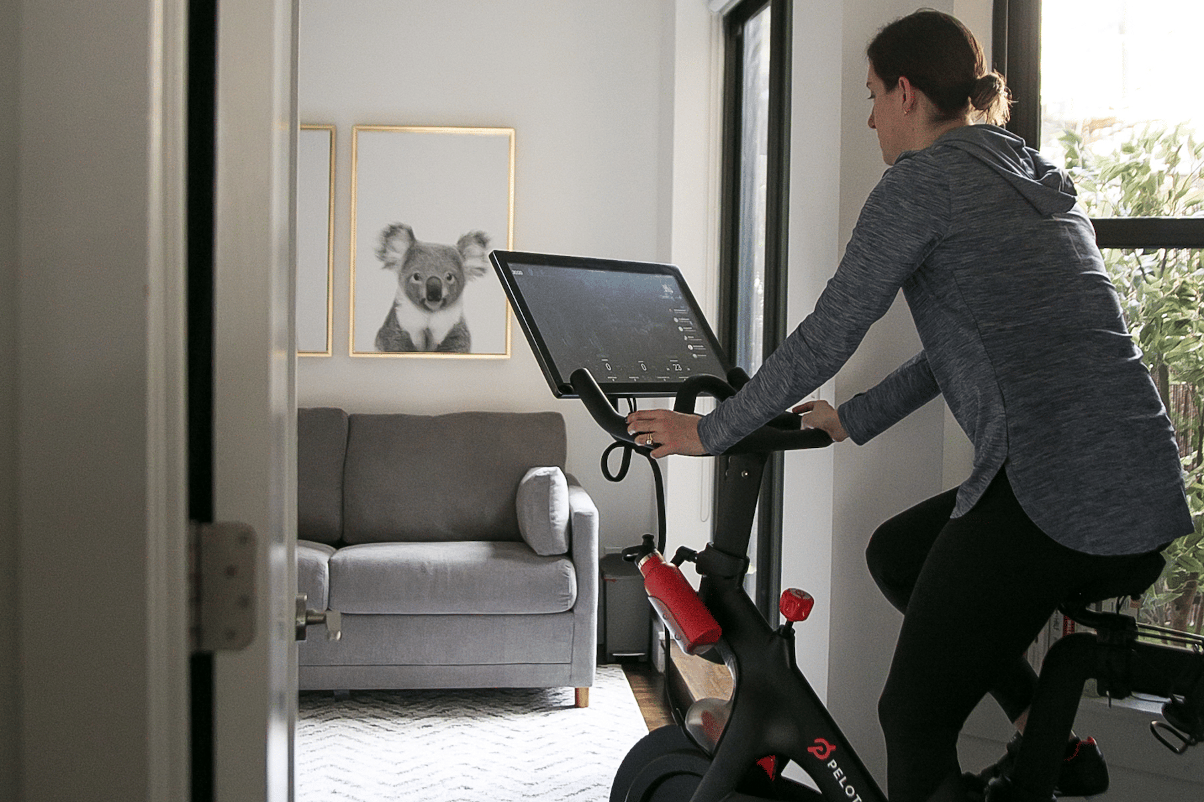 Woman jogs outdoors with her dog.