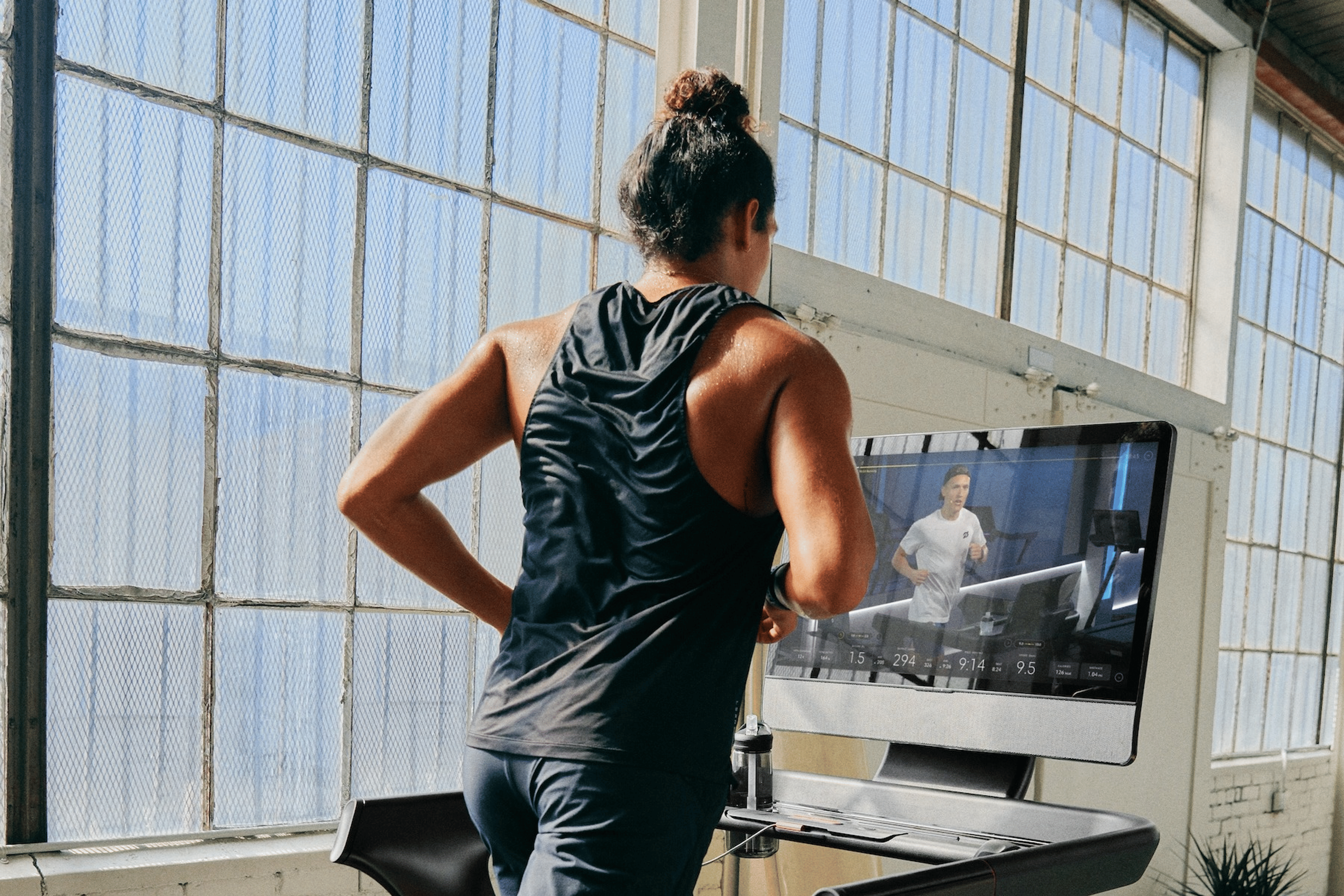 Man using the Peloton App outside