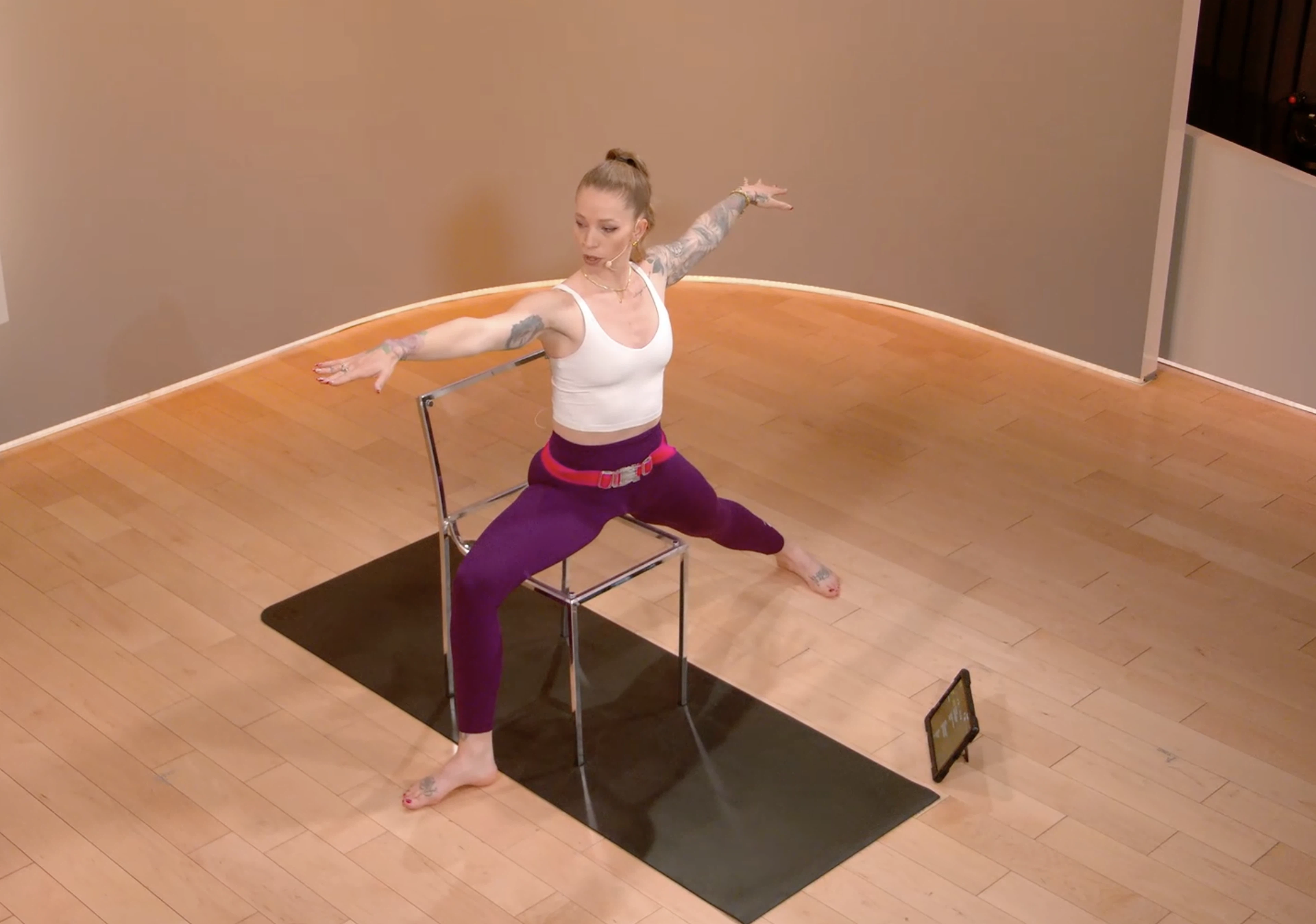 Kirra Michel doing Warrior 2 with chair