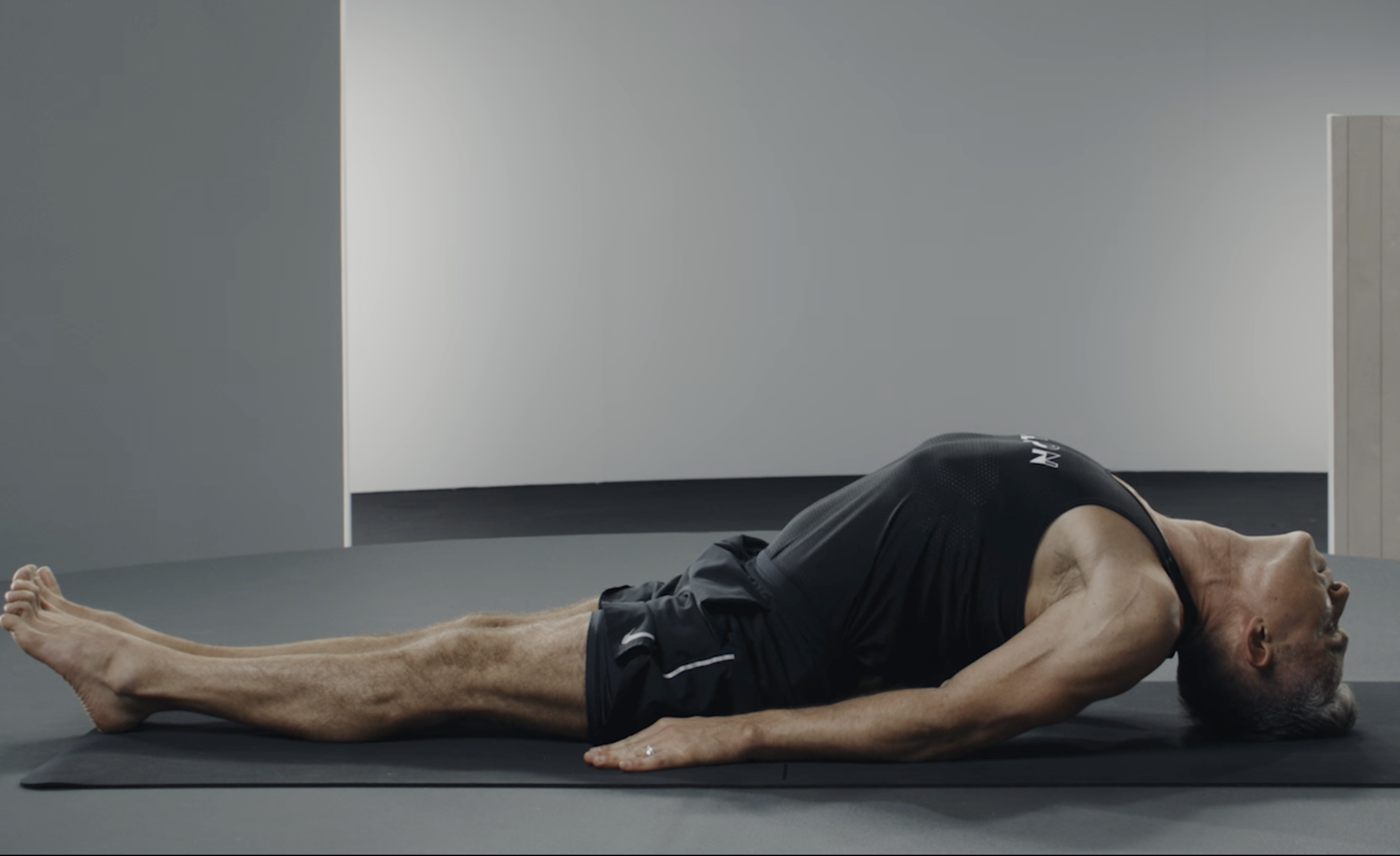 Man does Fish Pose, a heart-opening yoga pose