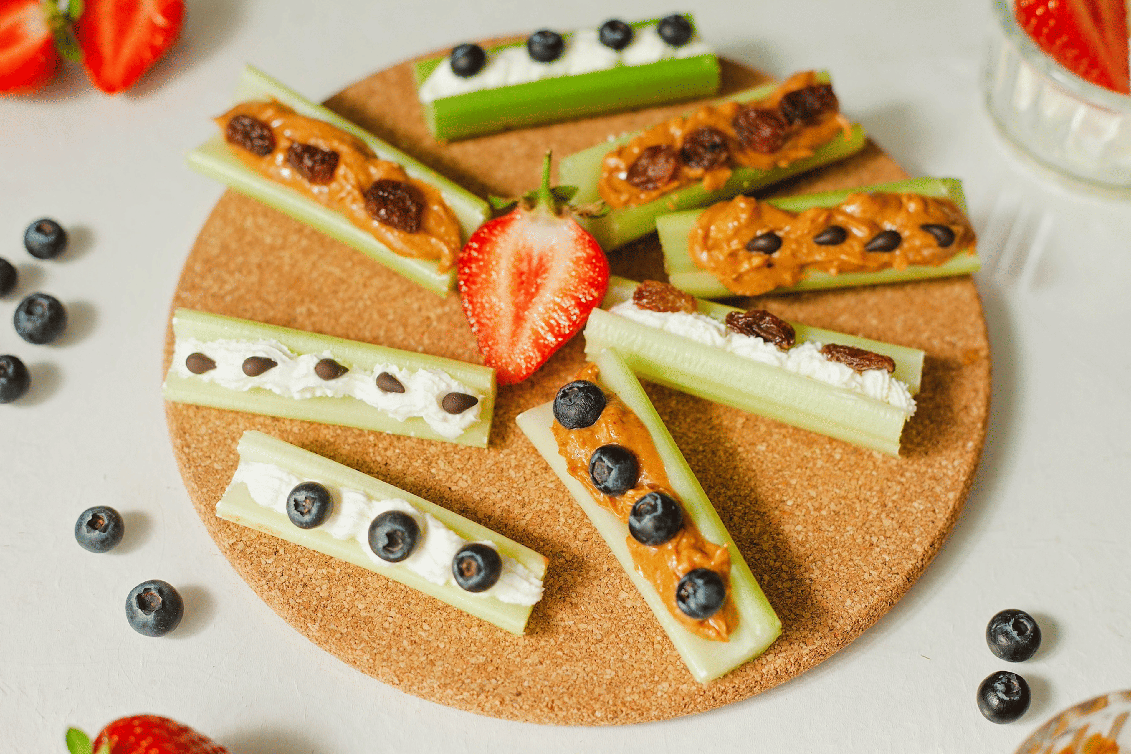 A plate of "ants on a log" celery stalks, which are hydrating foods.