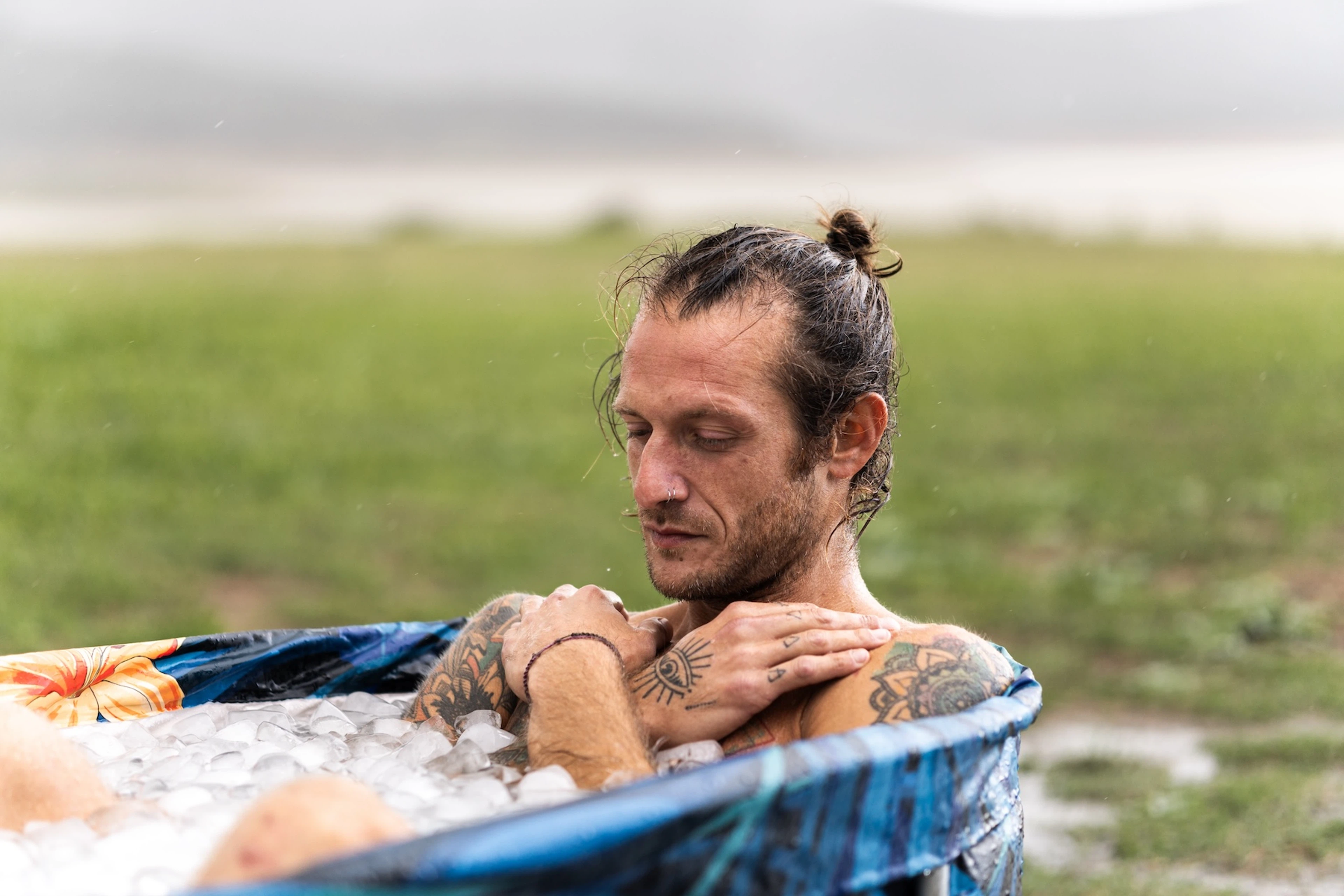 A man in an ice bath after a workout.