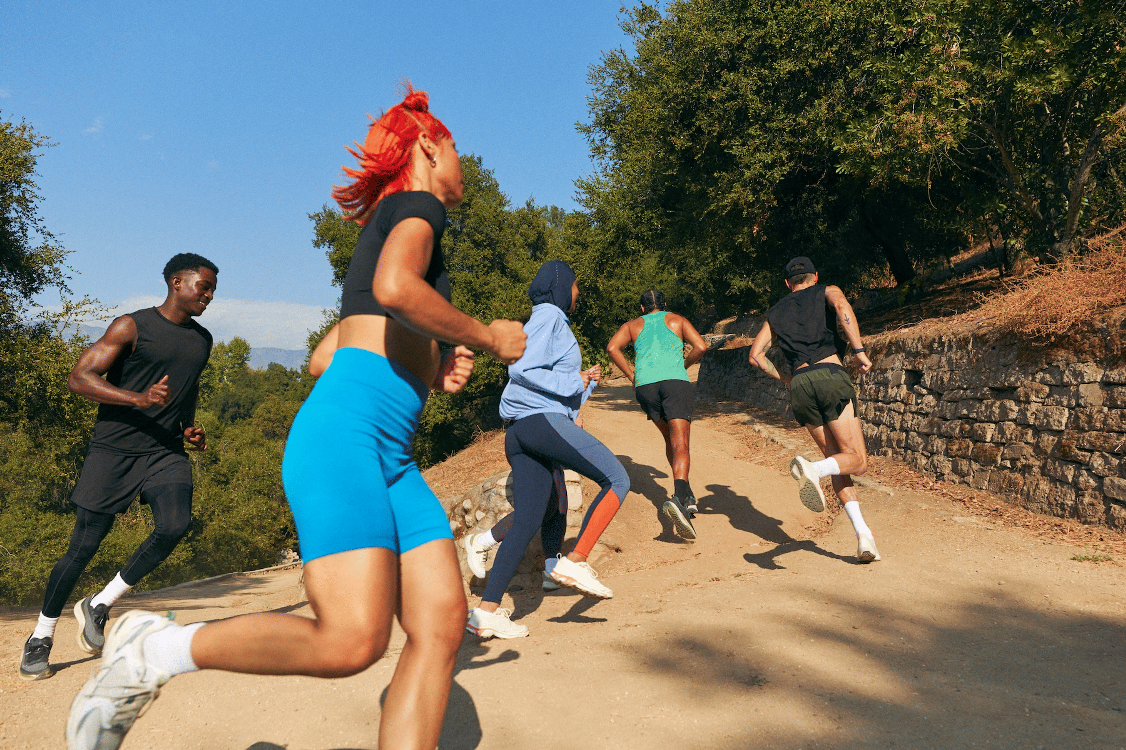 Group of Peloton members running together 