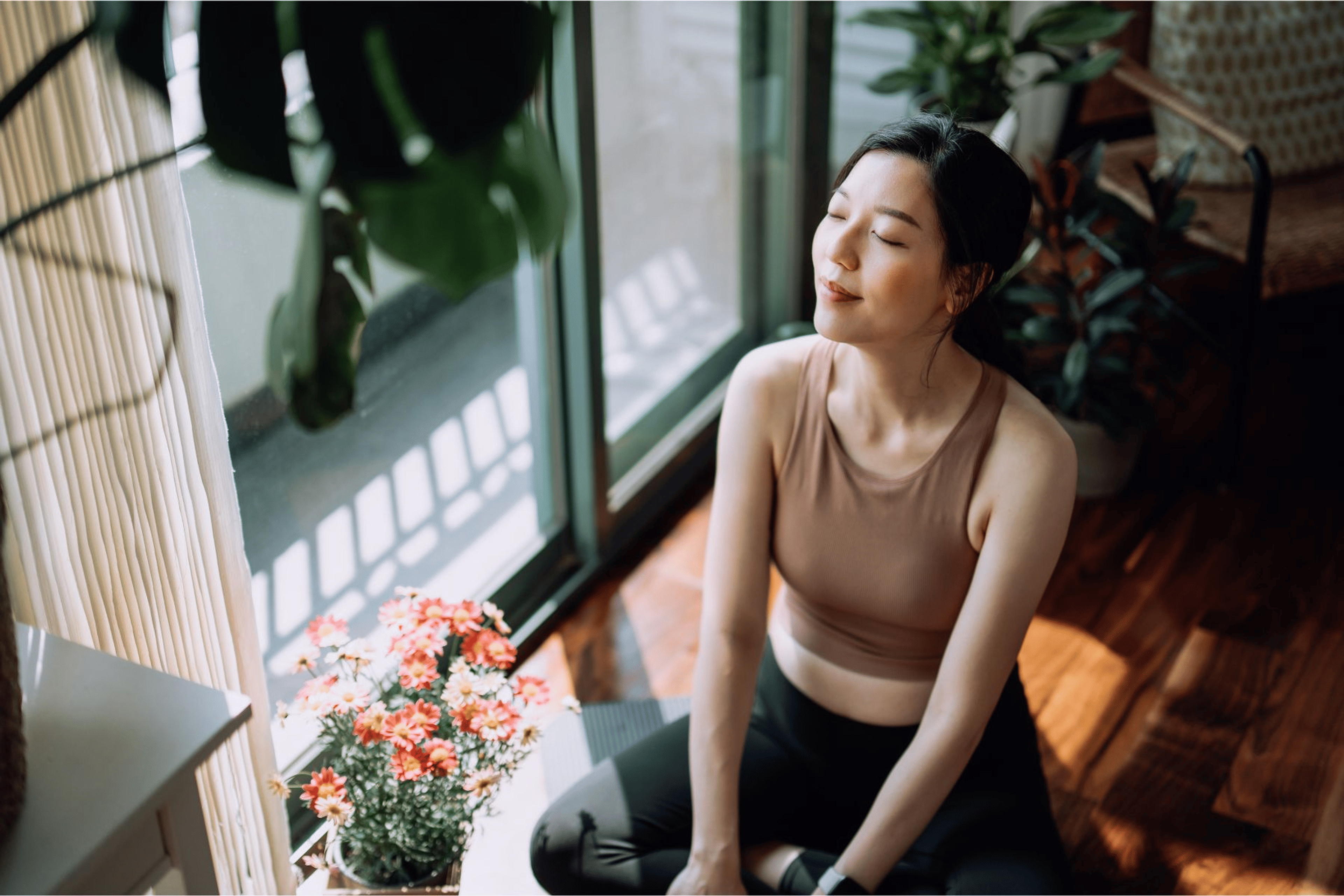 Woman meditating by a window