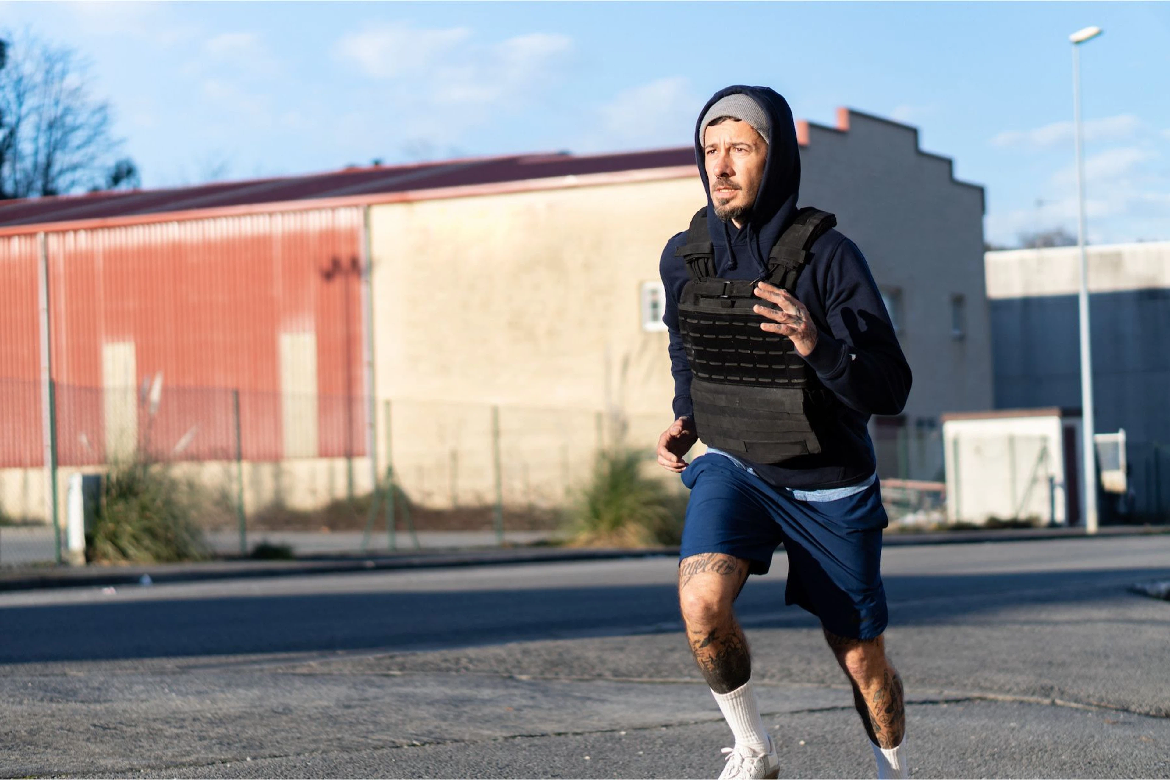 Man running in a weighted vest