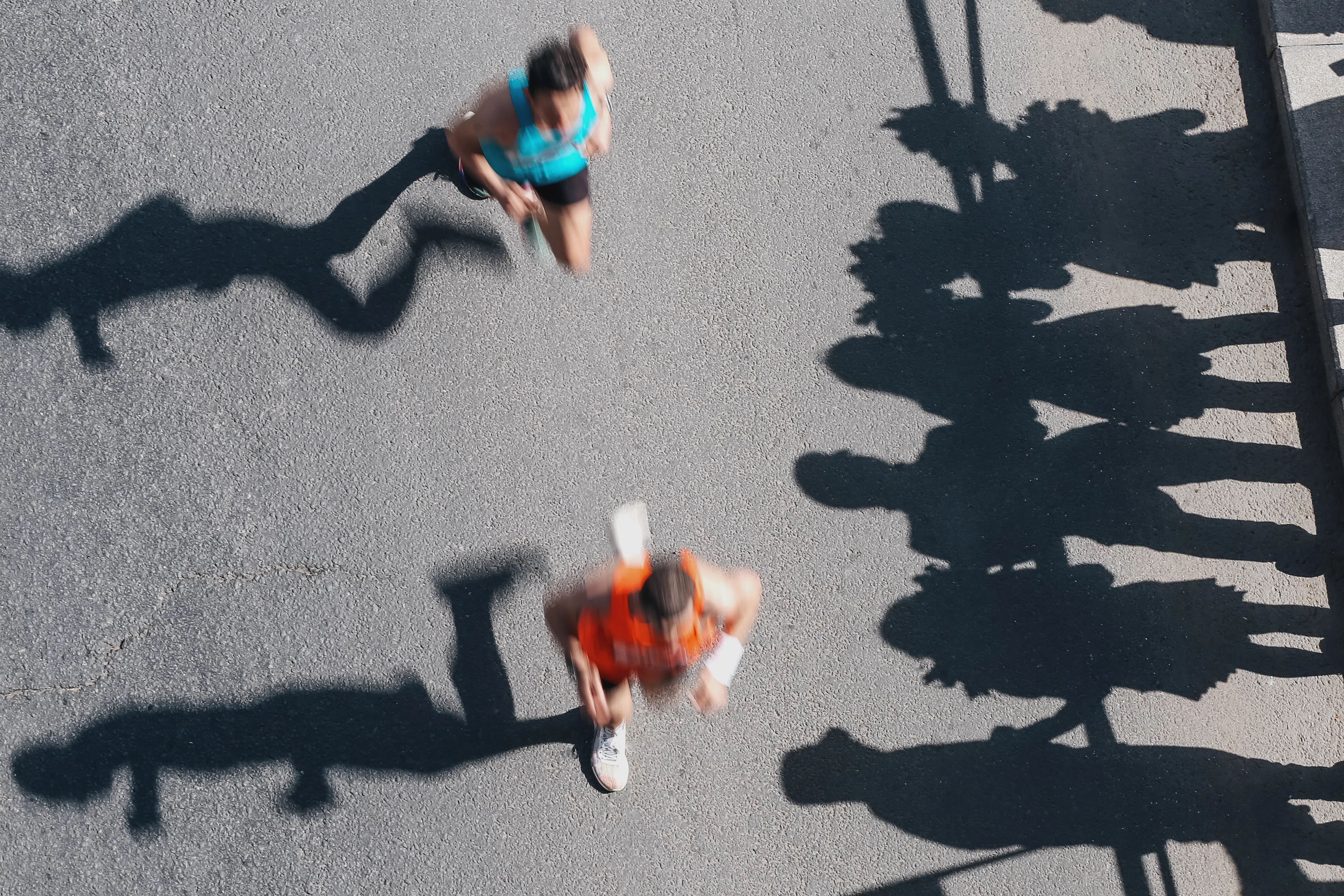 Overhead shot of runners racing a half marathon and preparing for post-half marathon recovery.