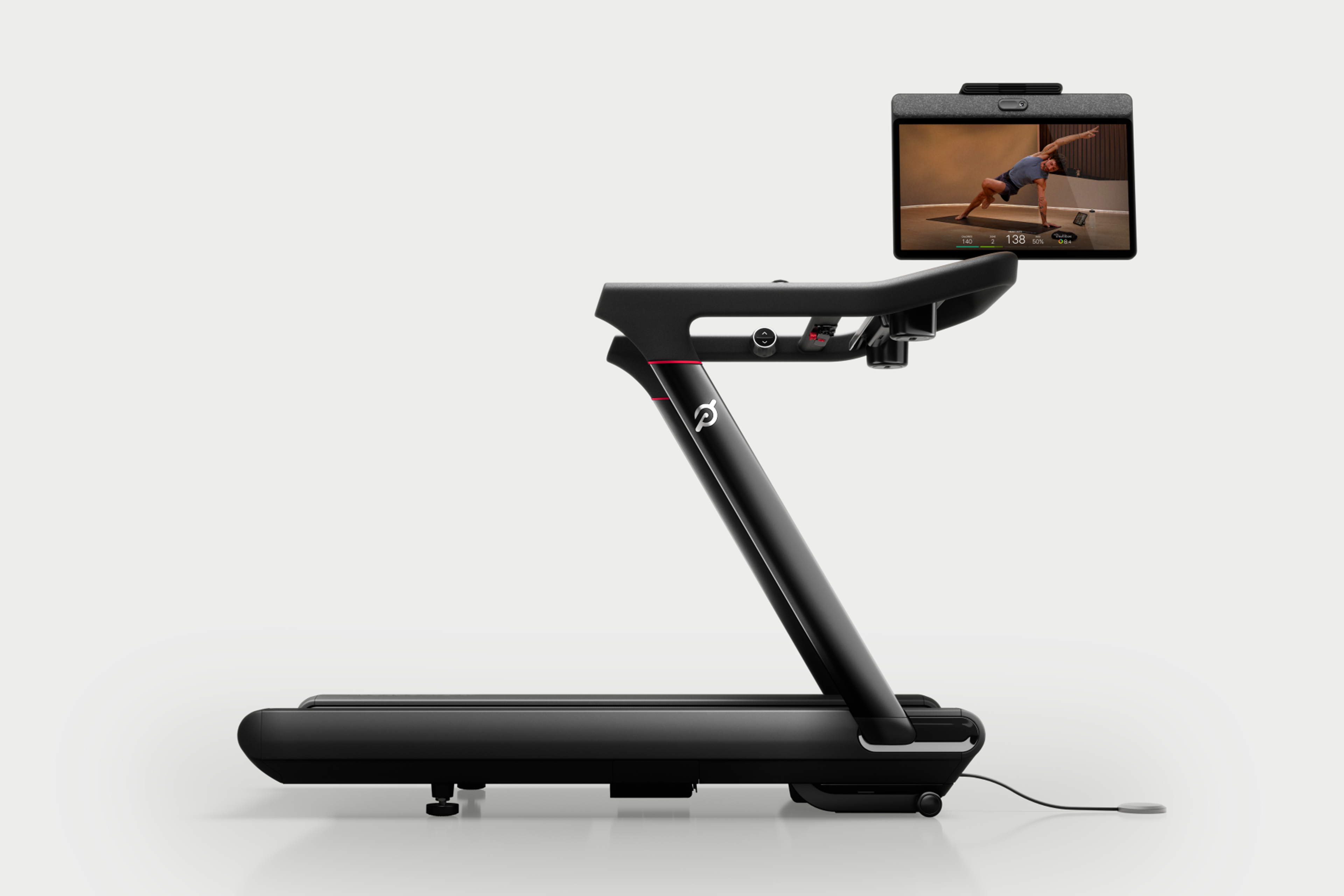 the Peloton Tread Vision treadmill with the screen swiveled to show a yoga class