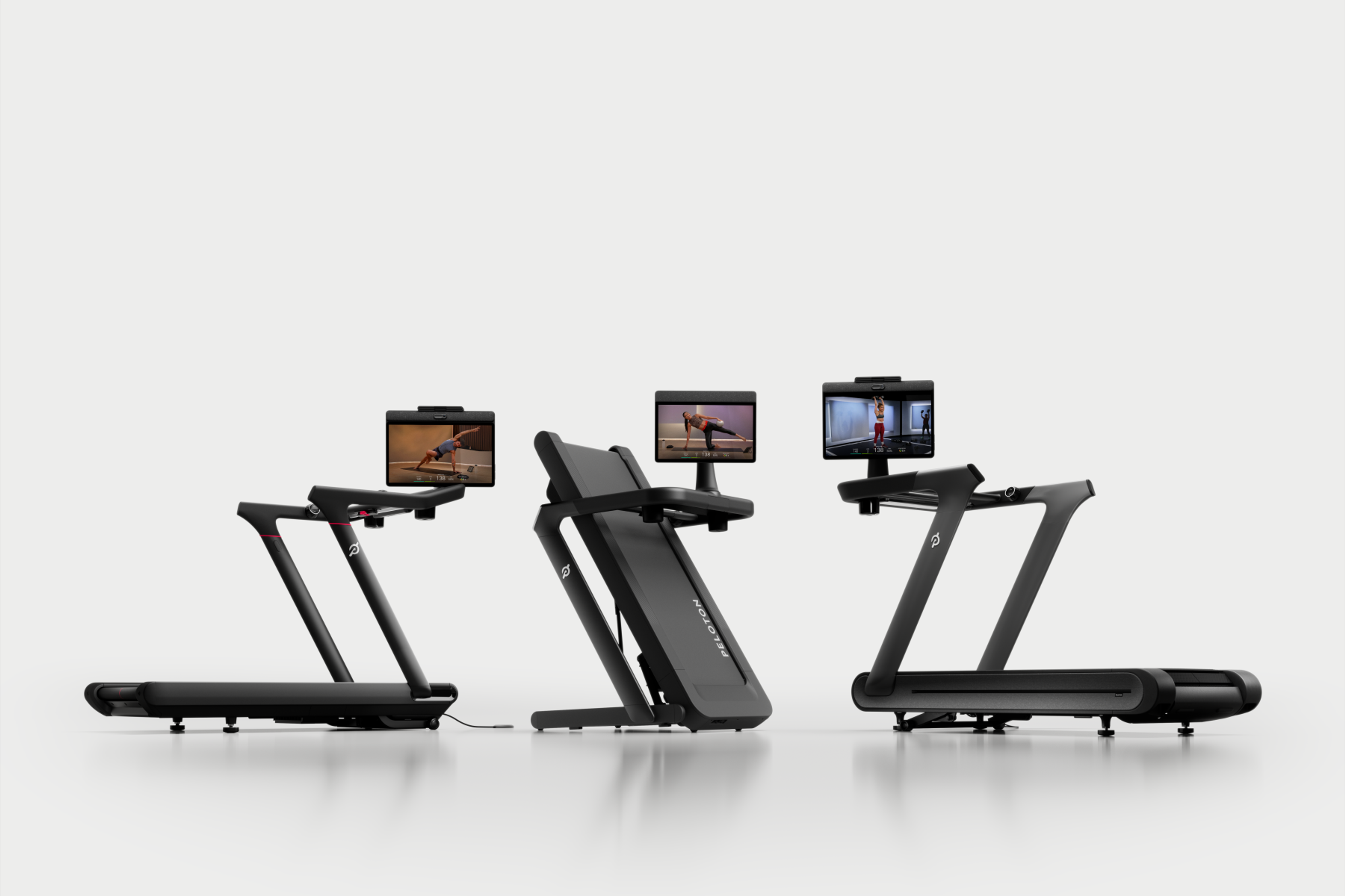 lineup of Peloton treadmills including the Peloton Tread Vision, folding Peloton Tread Flex, and slat-belt Peloton Tread+ Vision