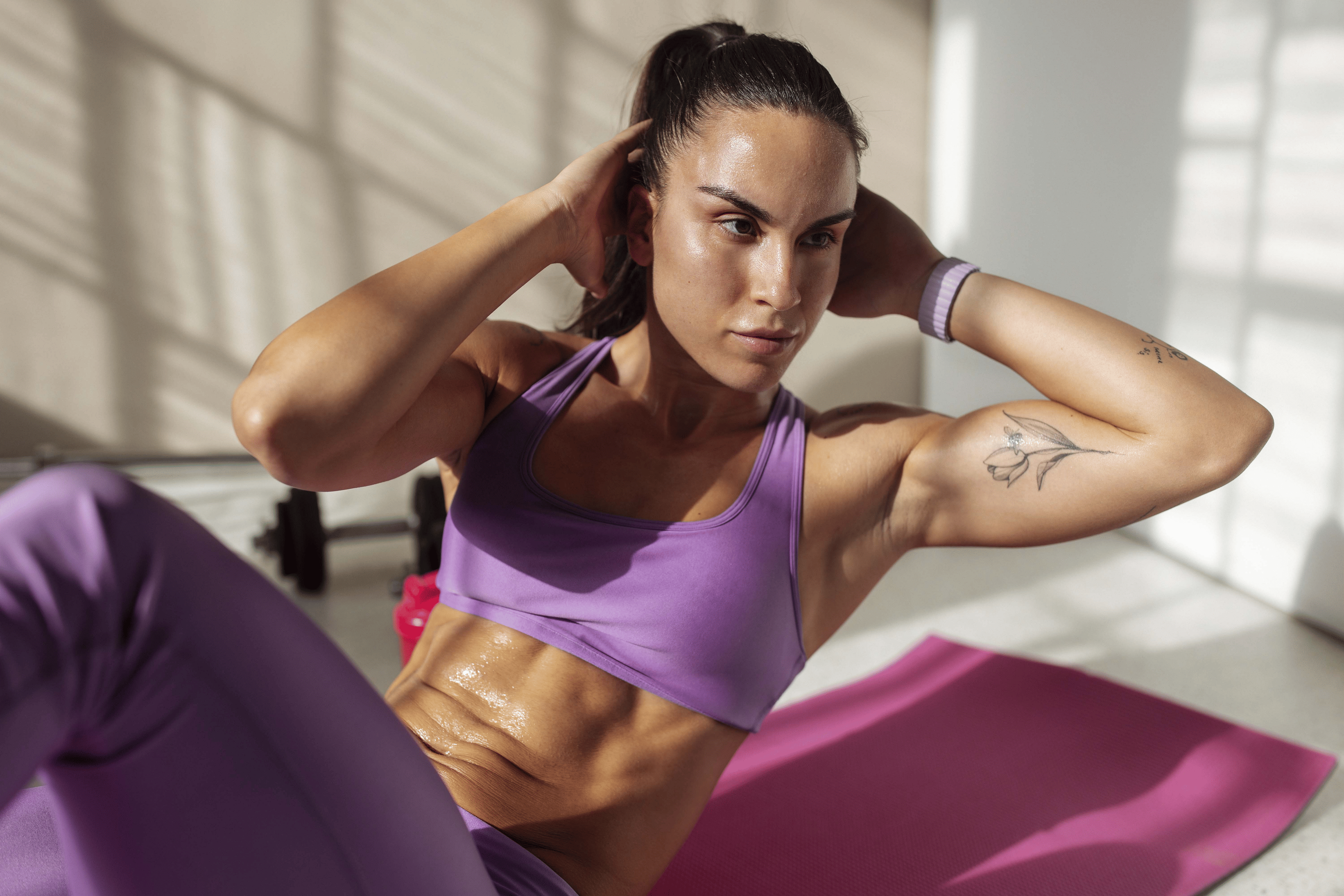 Woman doing oblique crunches during a home ab workout