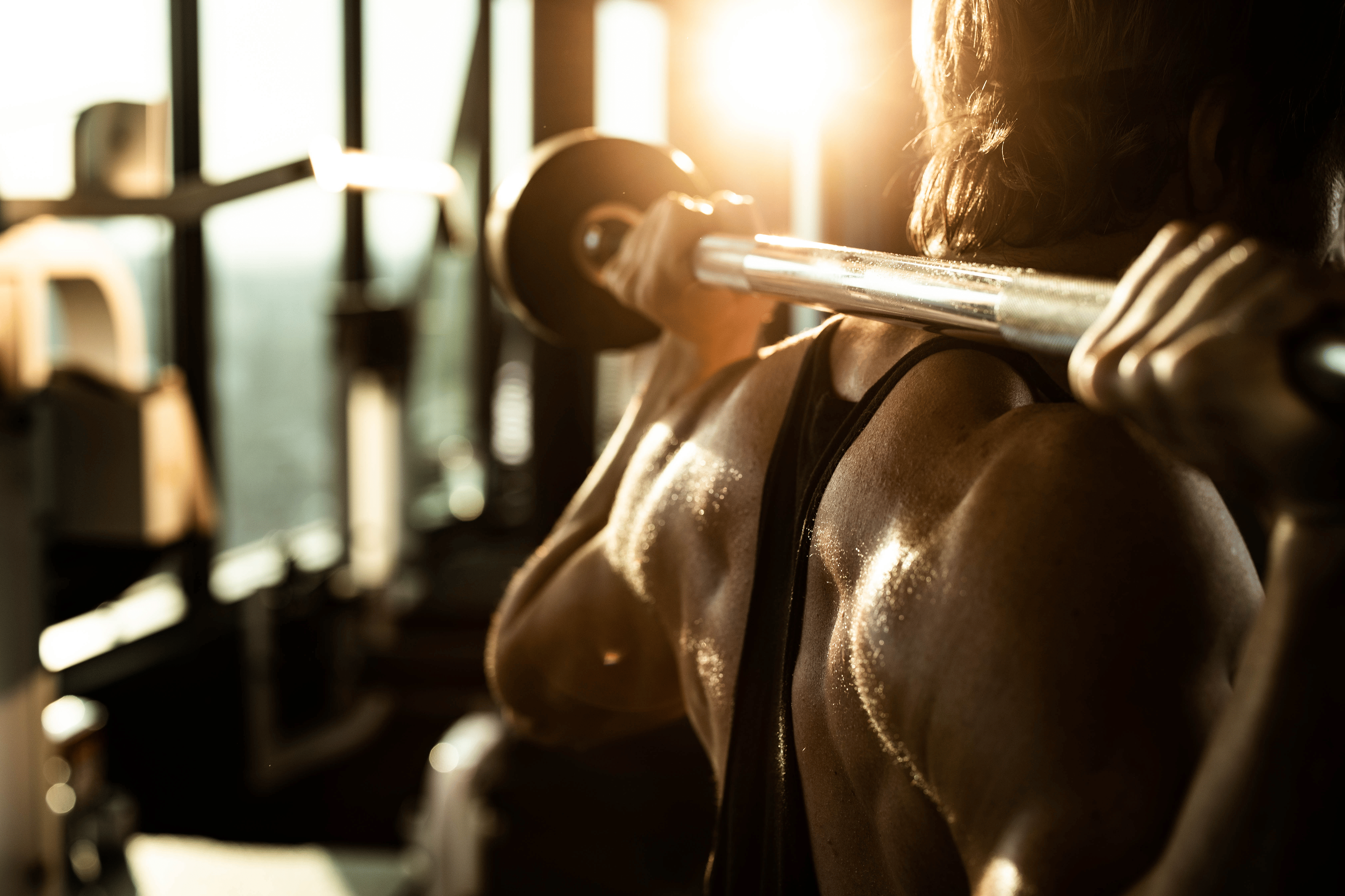 Man doing barbell back exercises 