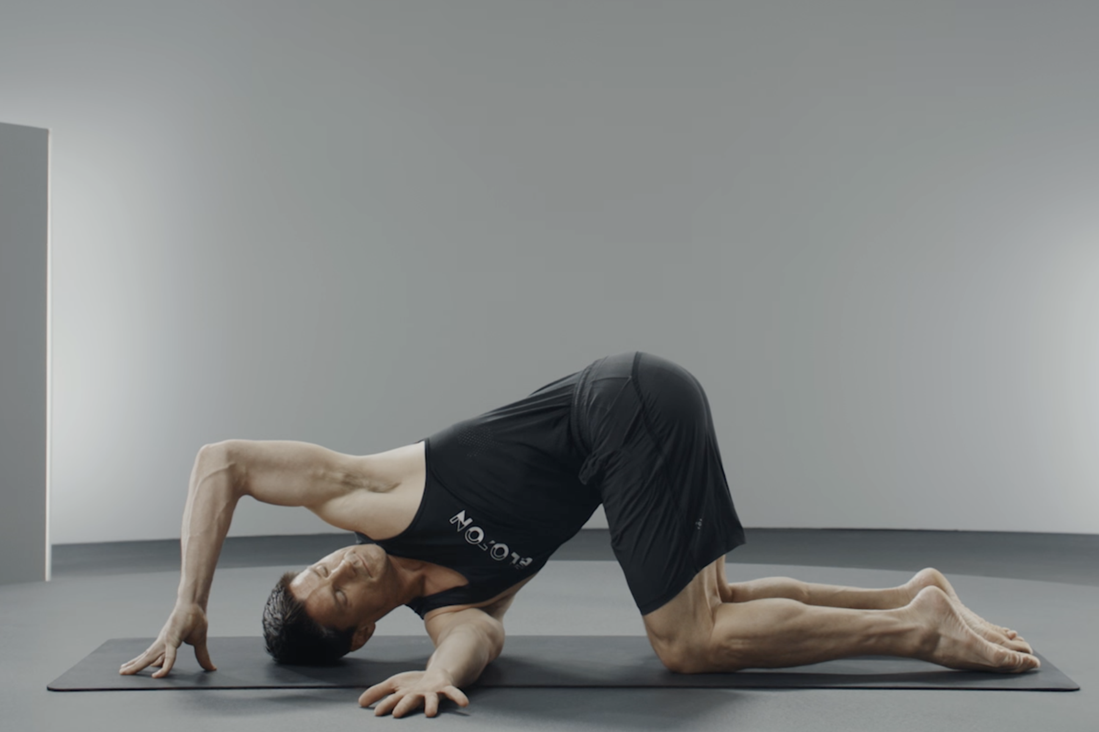 Man does Thread the Needle, a shoulder mobility exercise