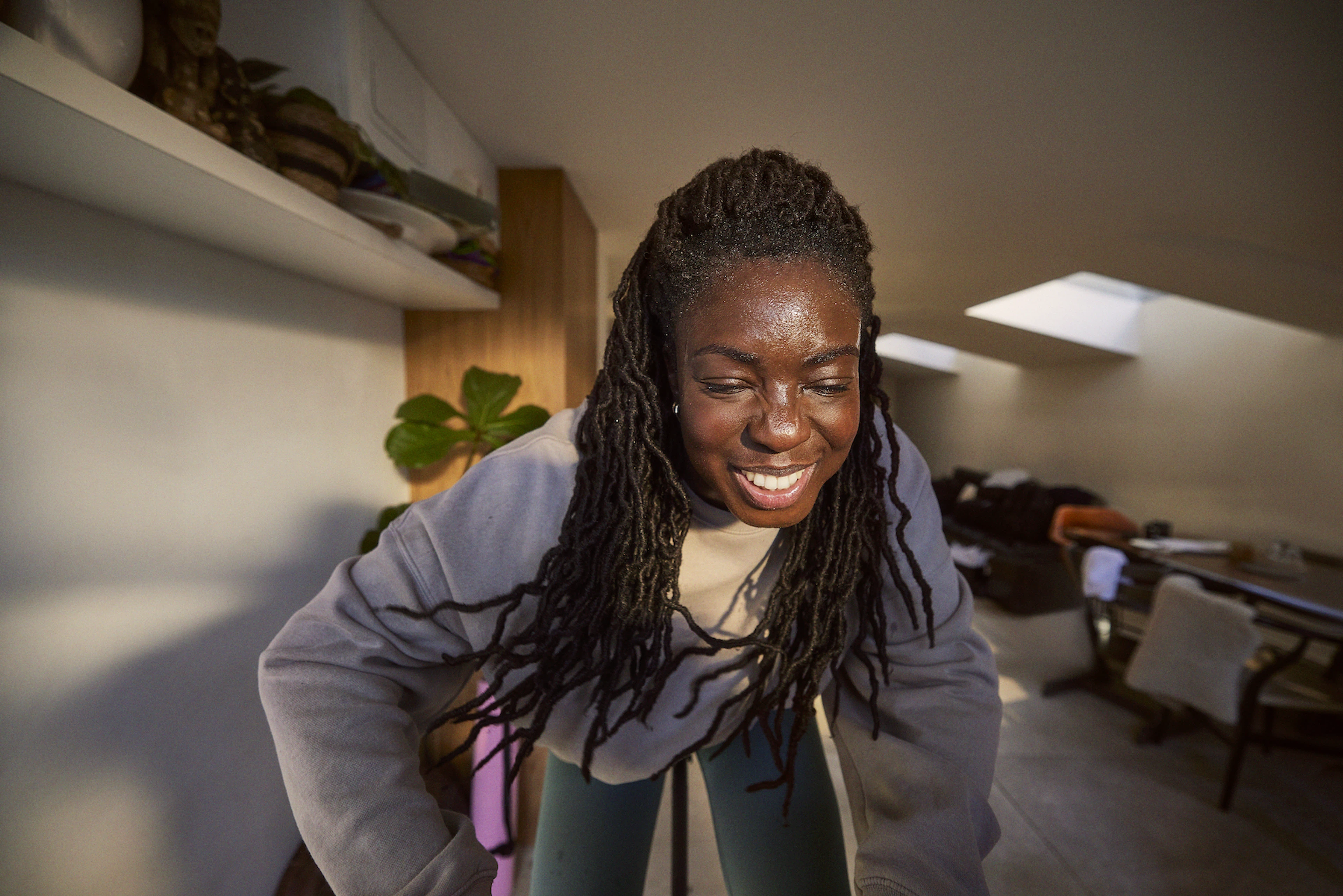 woman enjoying indoor cycling ride