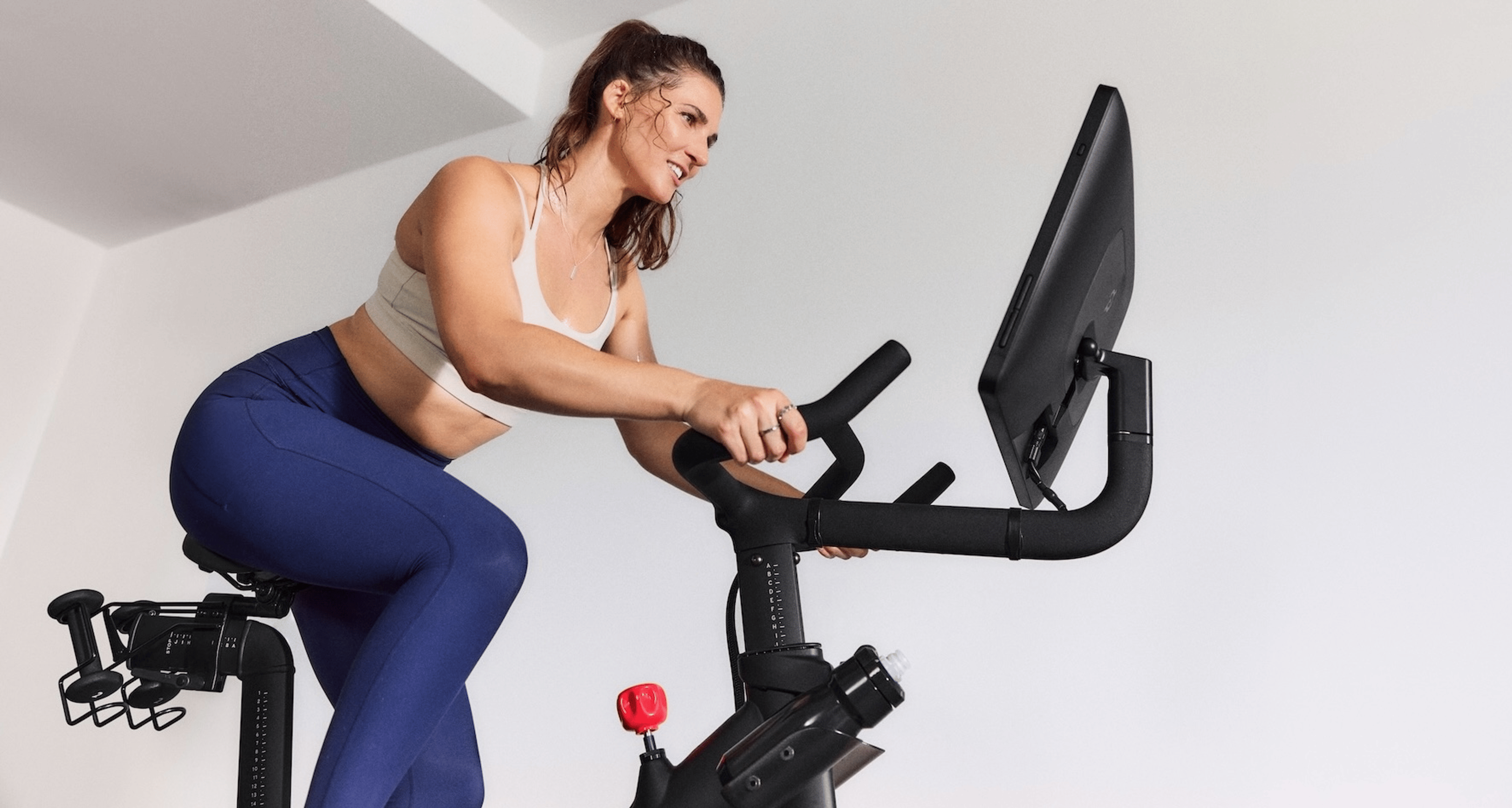 Woman on Peloton Bike