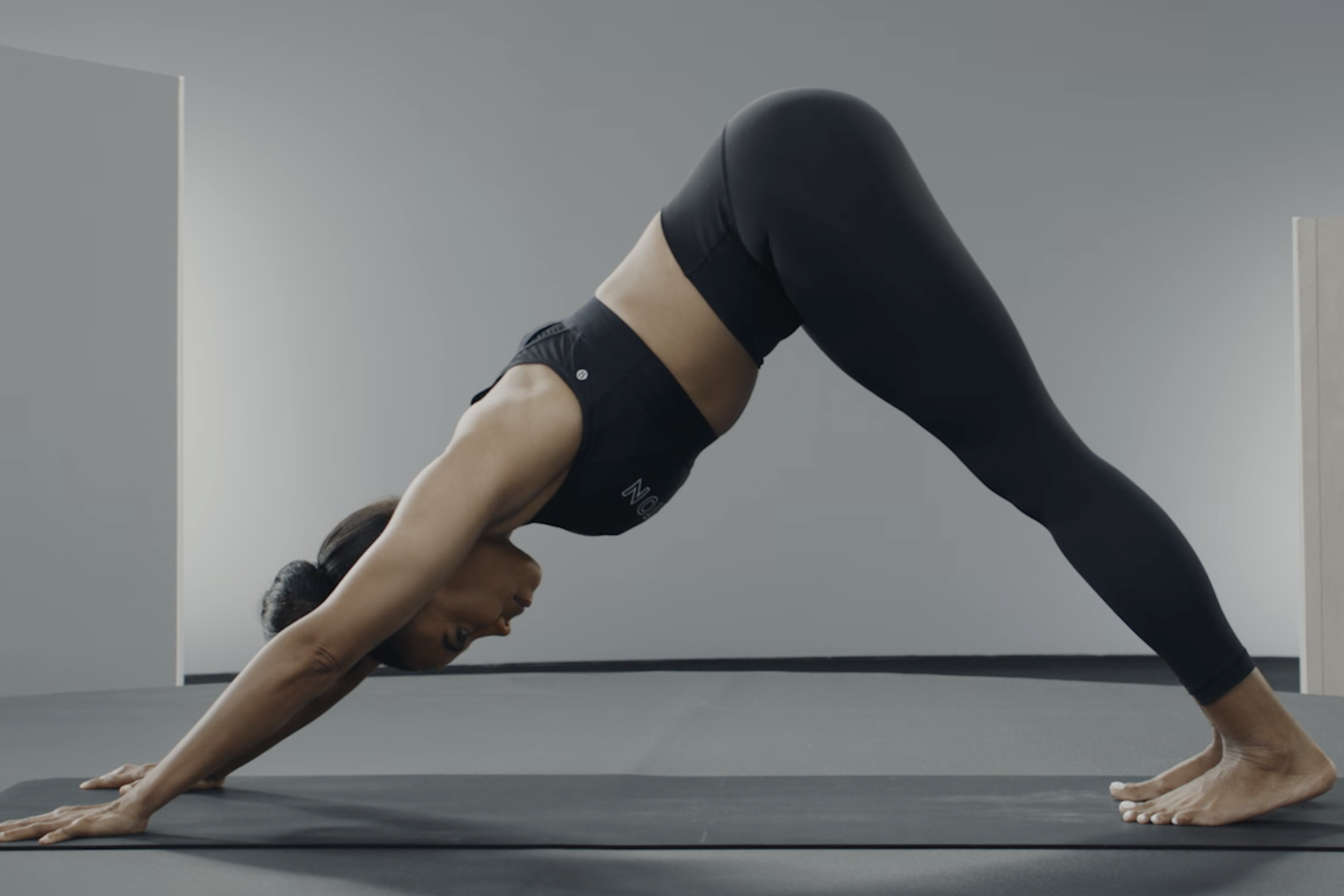 Woman demonstrates Downward-Facing Dog Pose