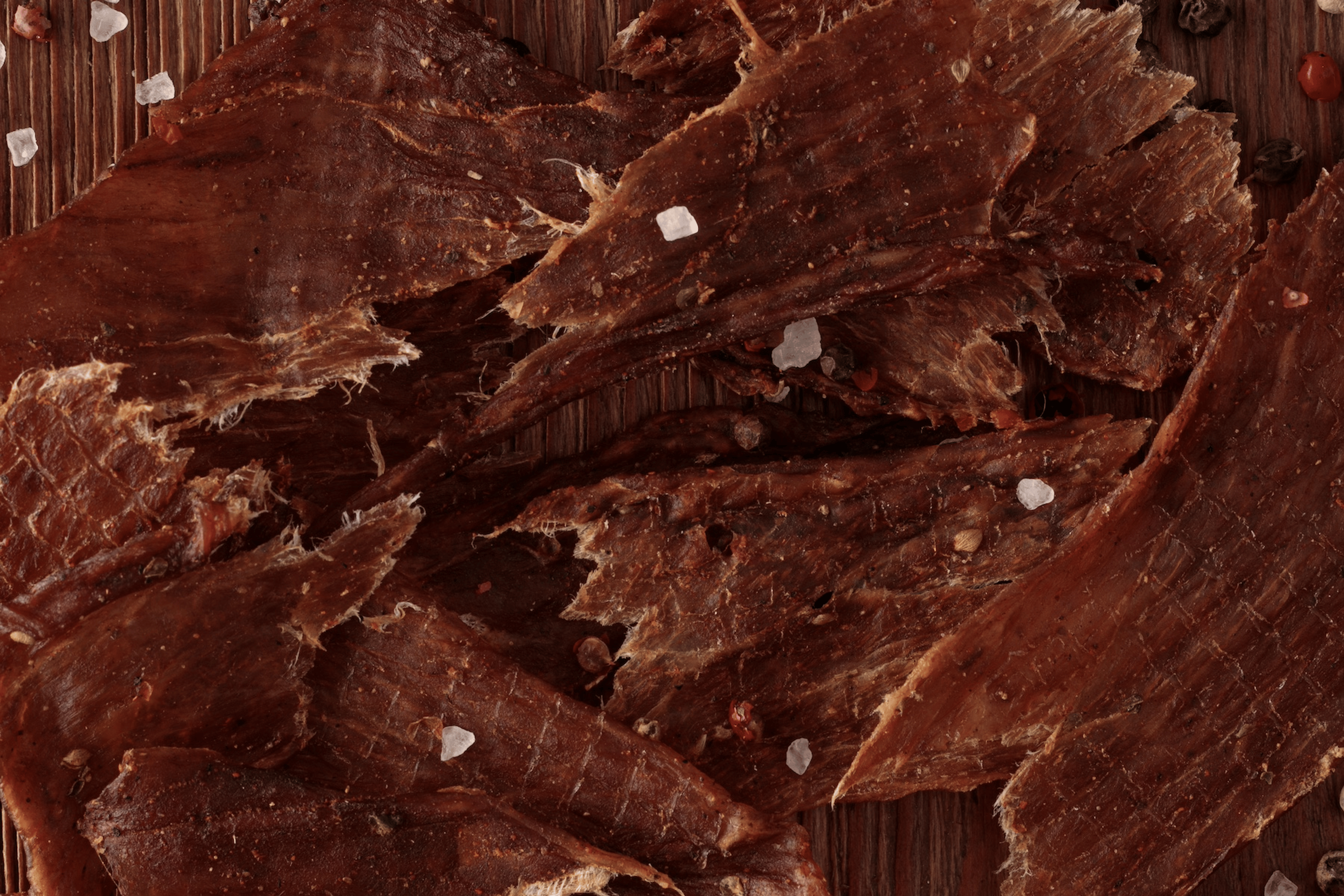 A close-up photo of beef jerky slices, which is a high-protein snack.