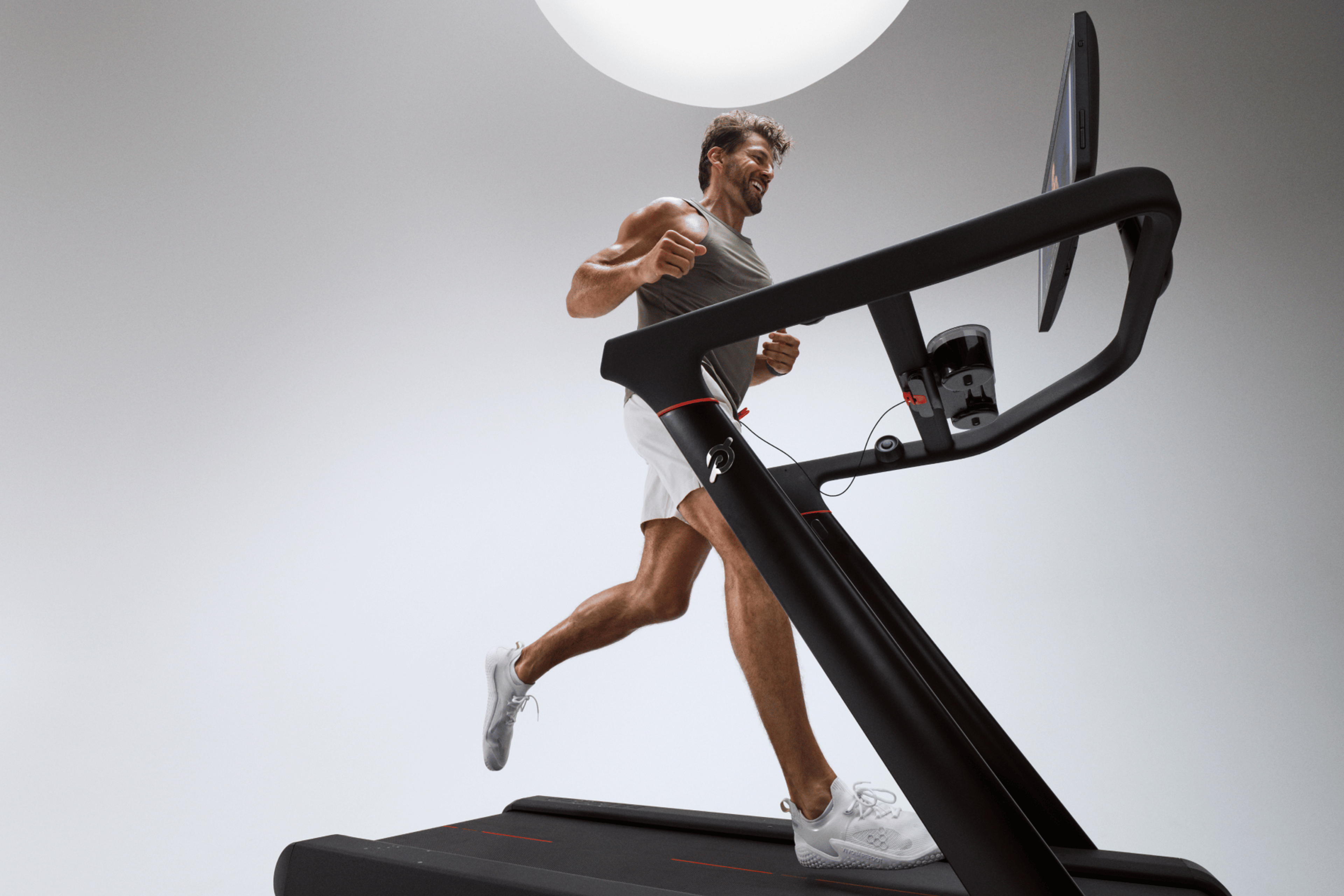 Peloton guest instructor Tim Robards running on the Peloton Cross Training Series Tread