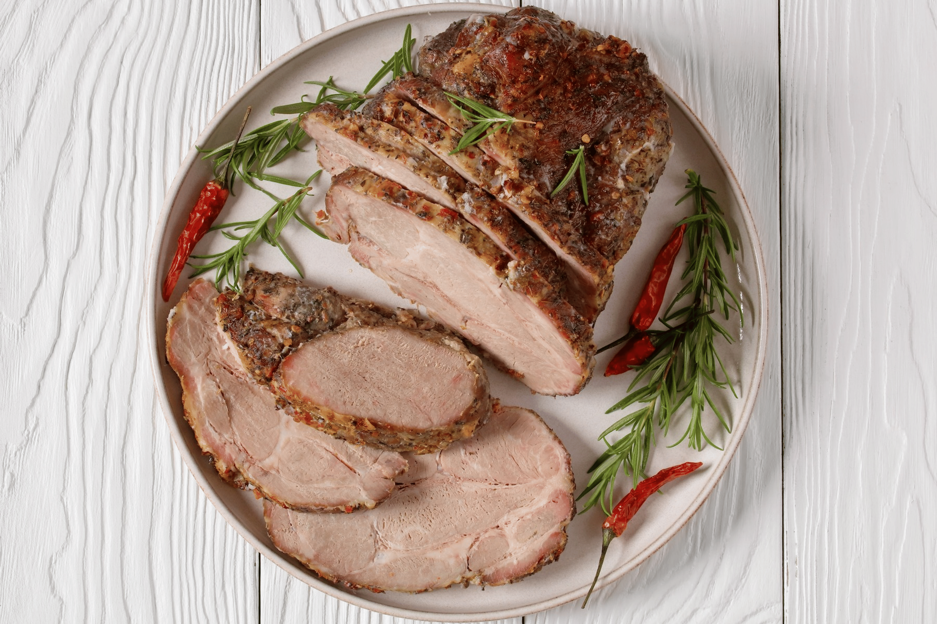A serving plate of roast pork loin (a creatine-rich food).