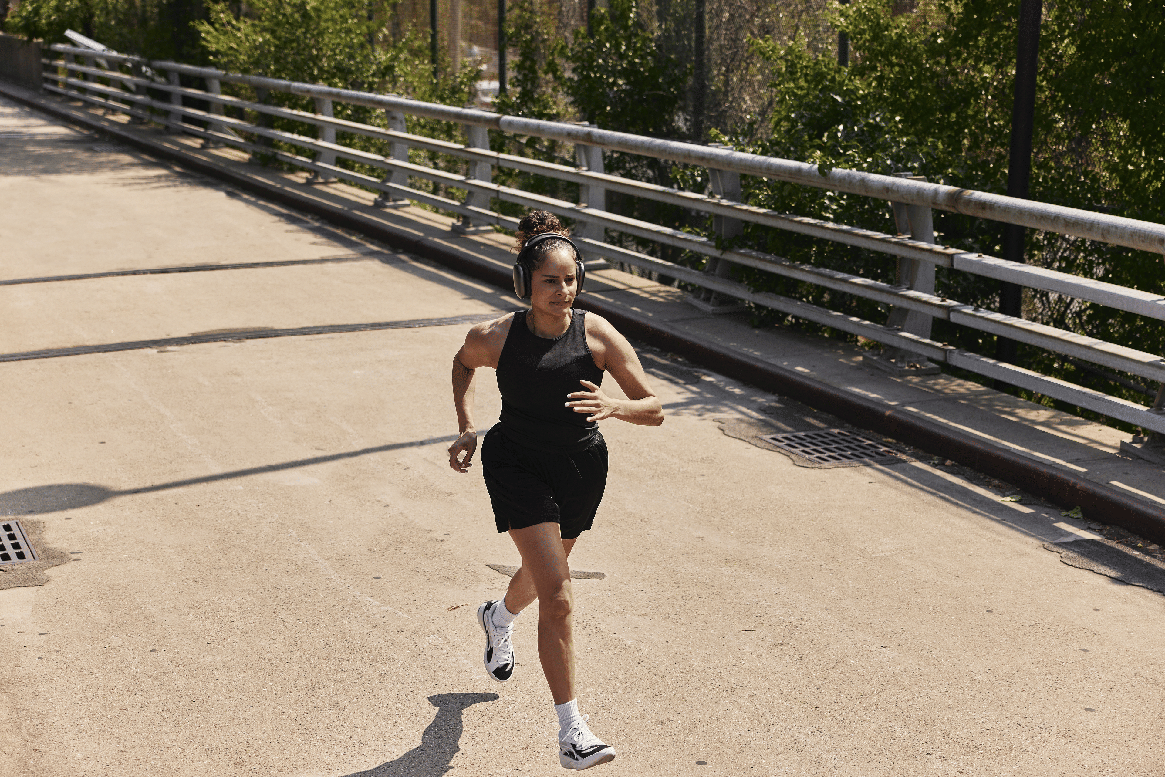 Woman running alone outside using a running mantra to stay focused.