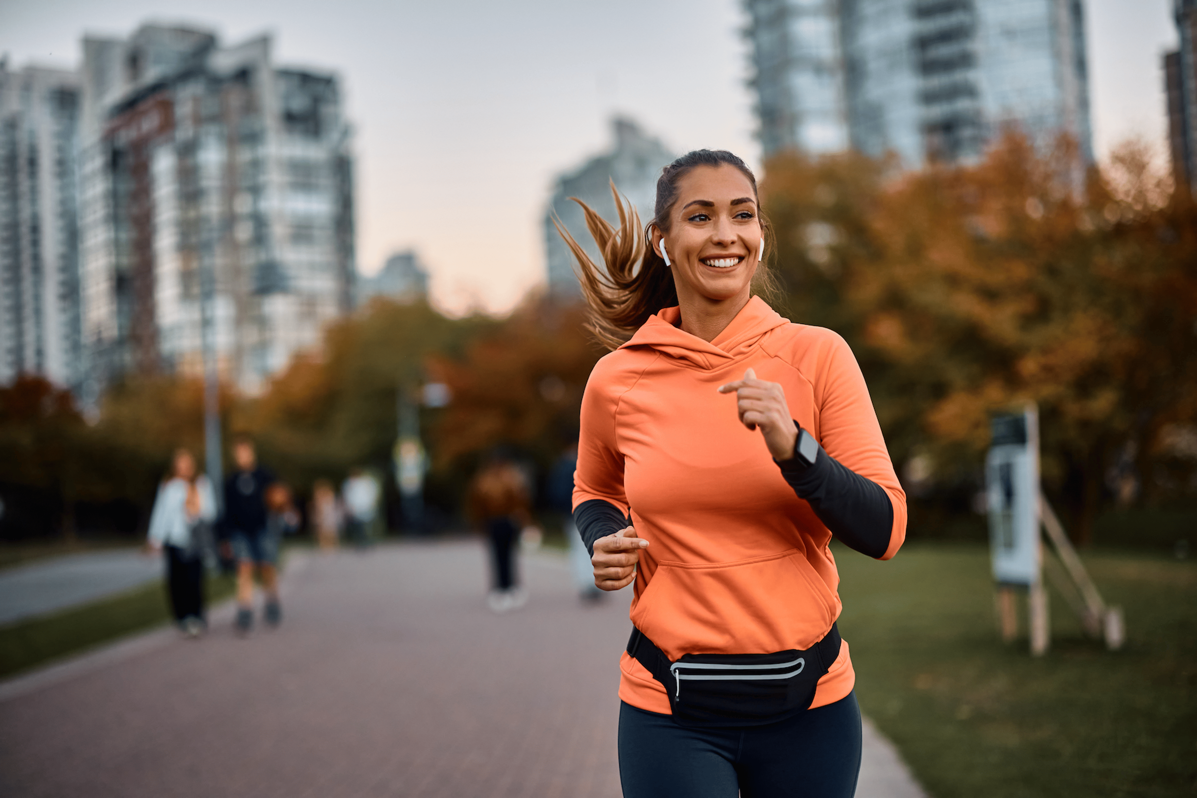 Woman runs outside after starting to run again after a break