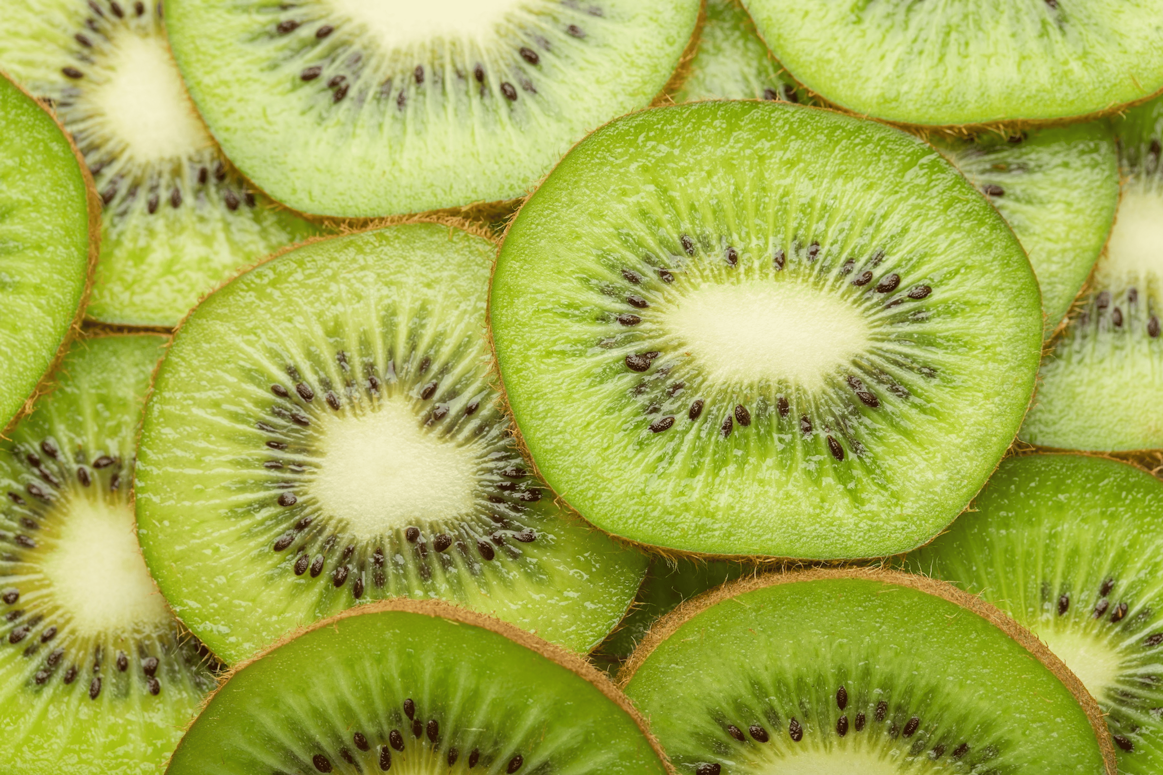 A close-up photo of sliced kiwi, which is a high-protein fruit.
