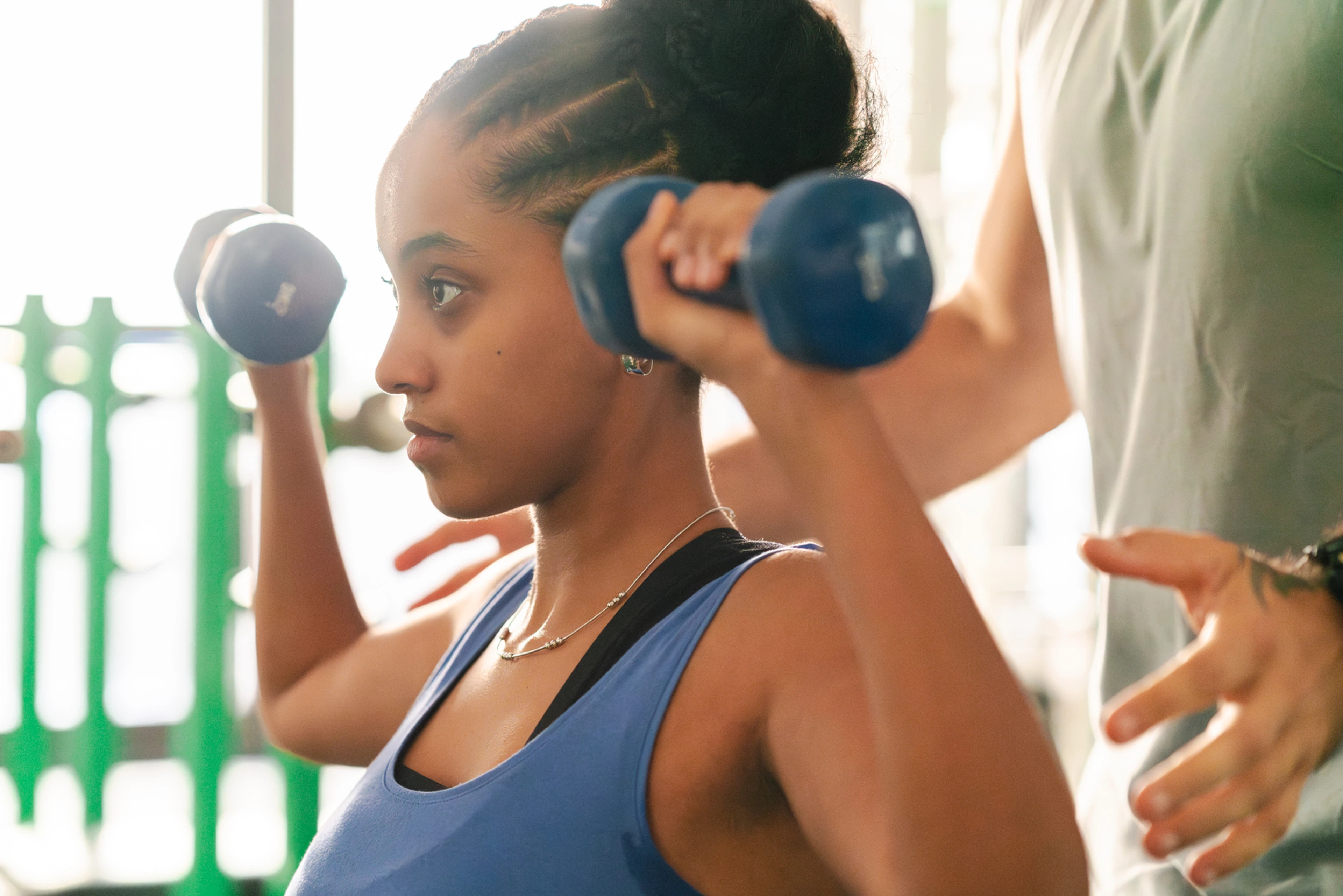 Woman lifting dumbbells 