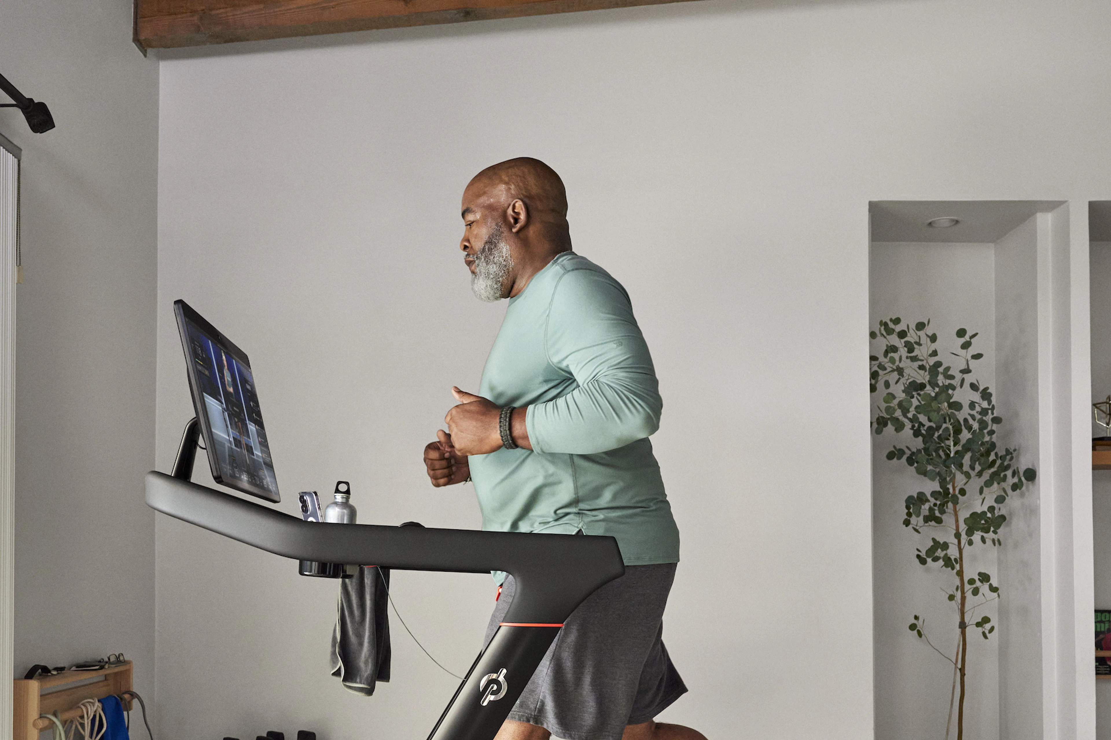 Man runs on a Peloton Tread