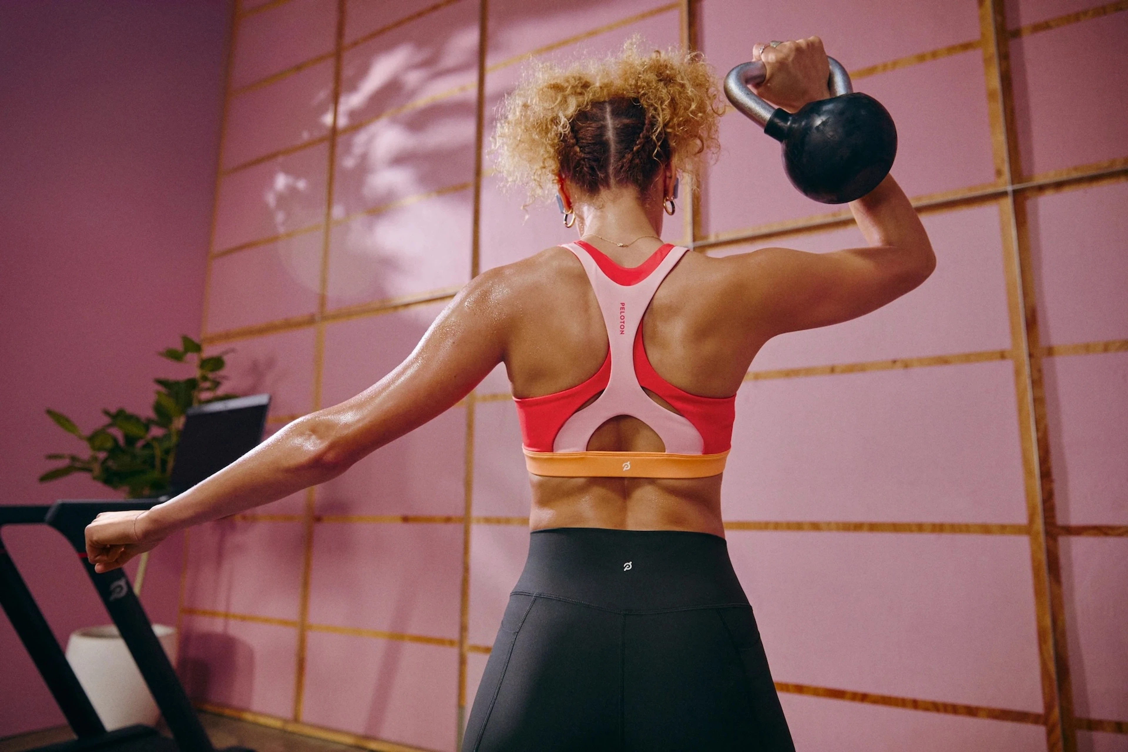 Woman leveling up her fitness using Peloton
