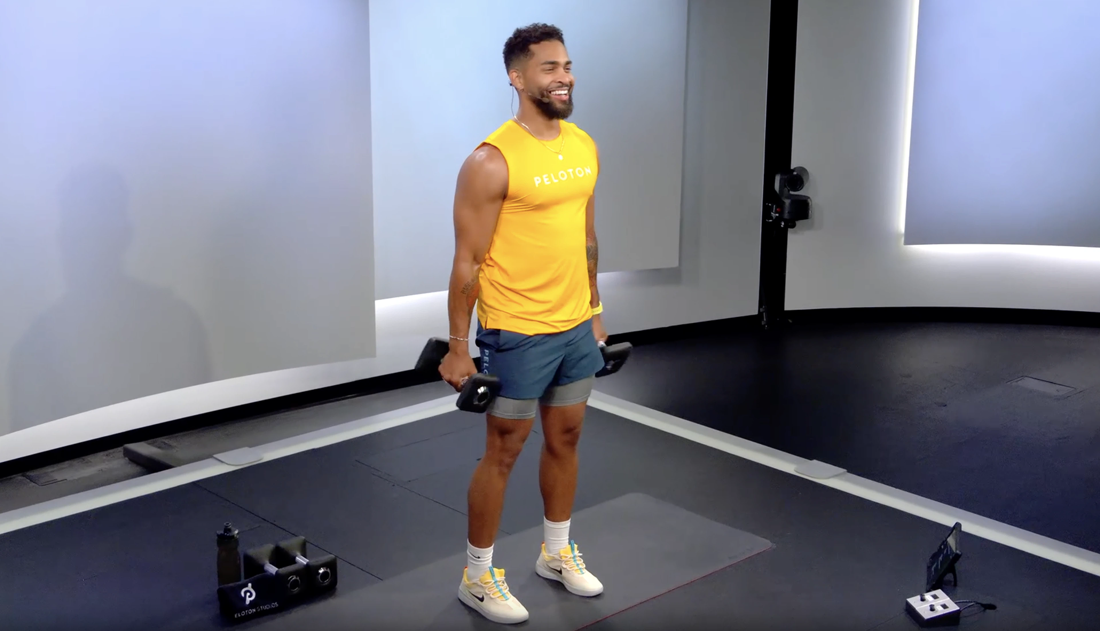 Rad Lopez demonstrates lateral raises in Peloton class