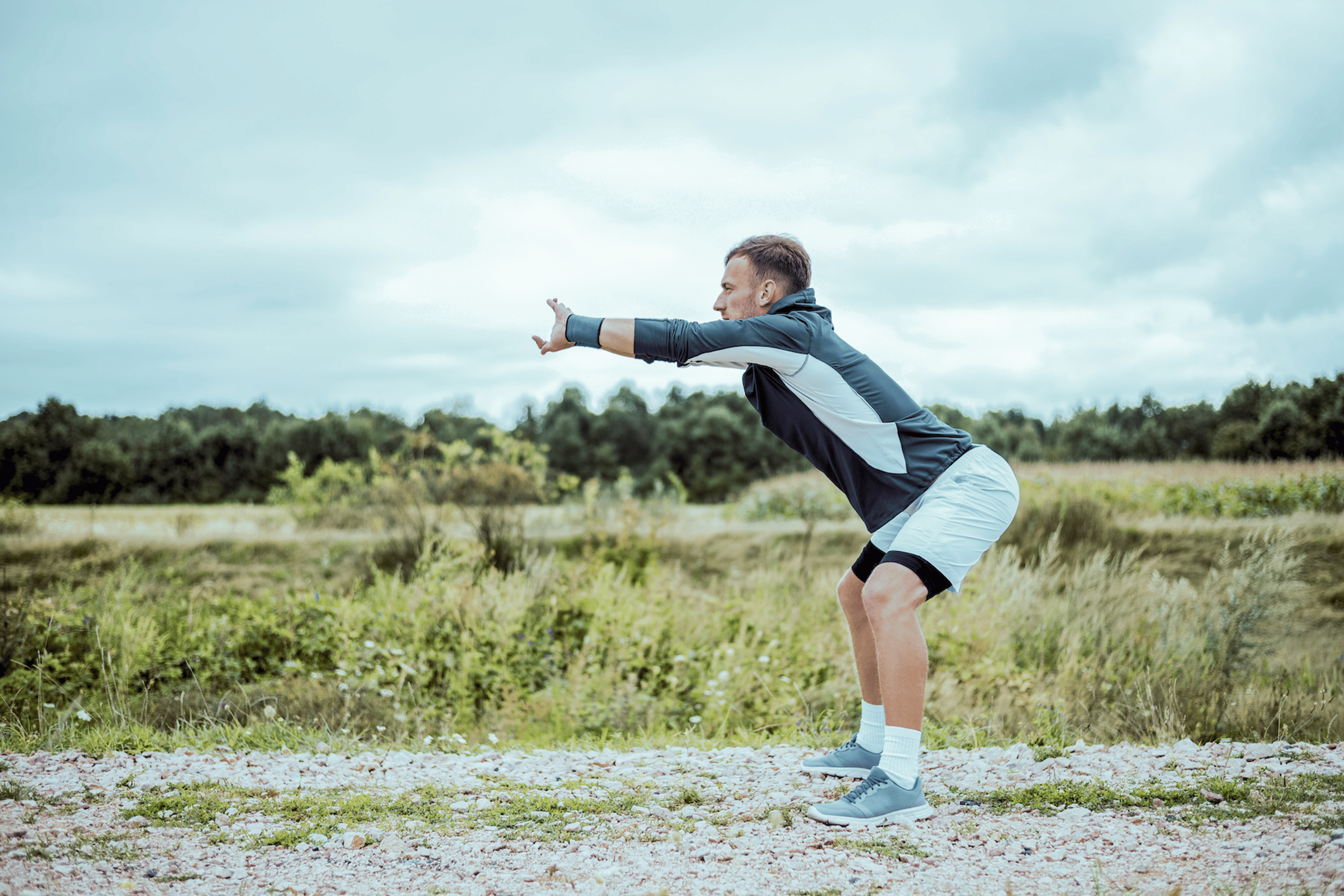 Man does a hip hinge exercise