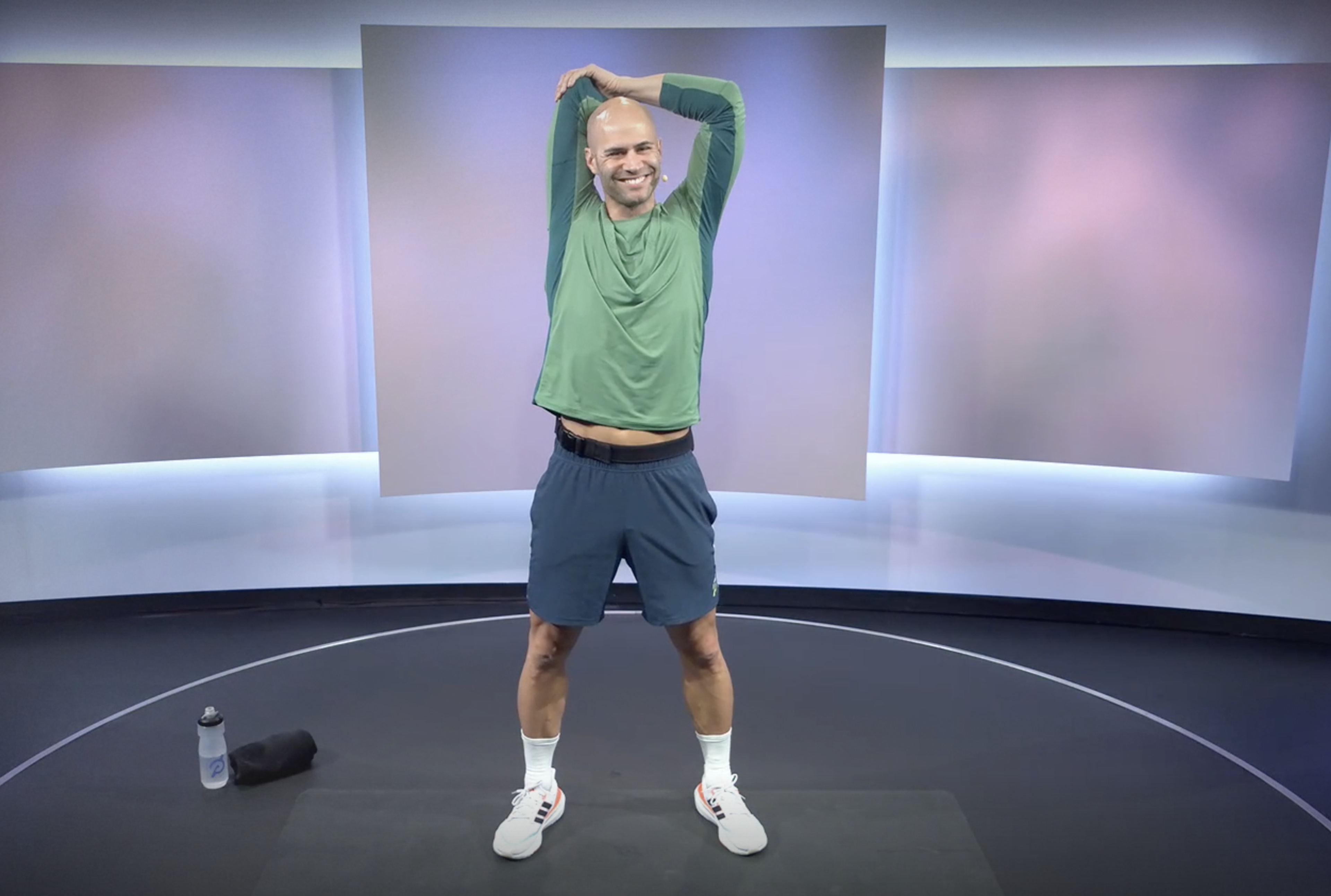 Man stretches triceps with overhead stretch