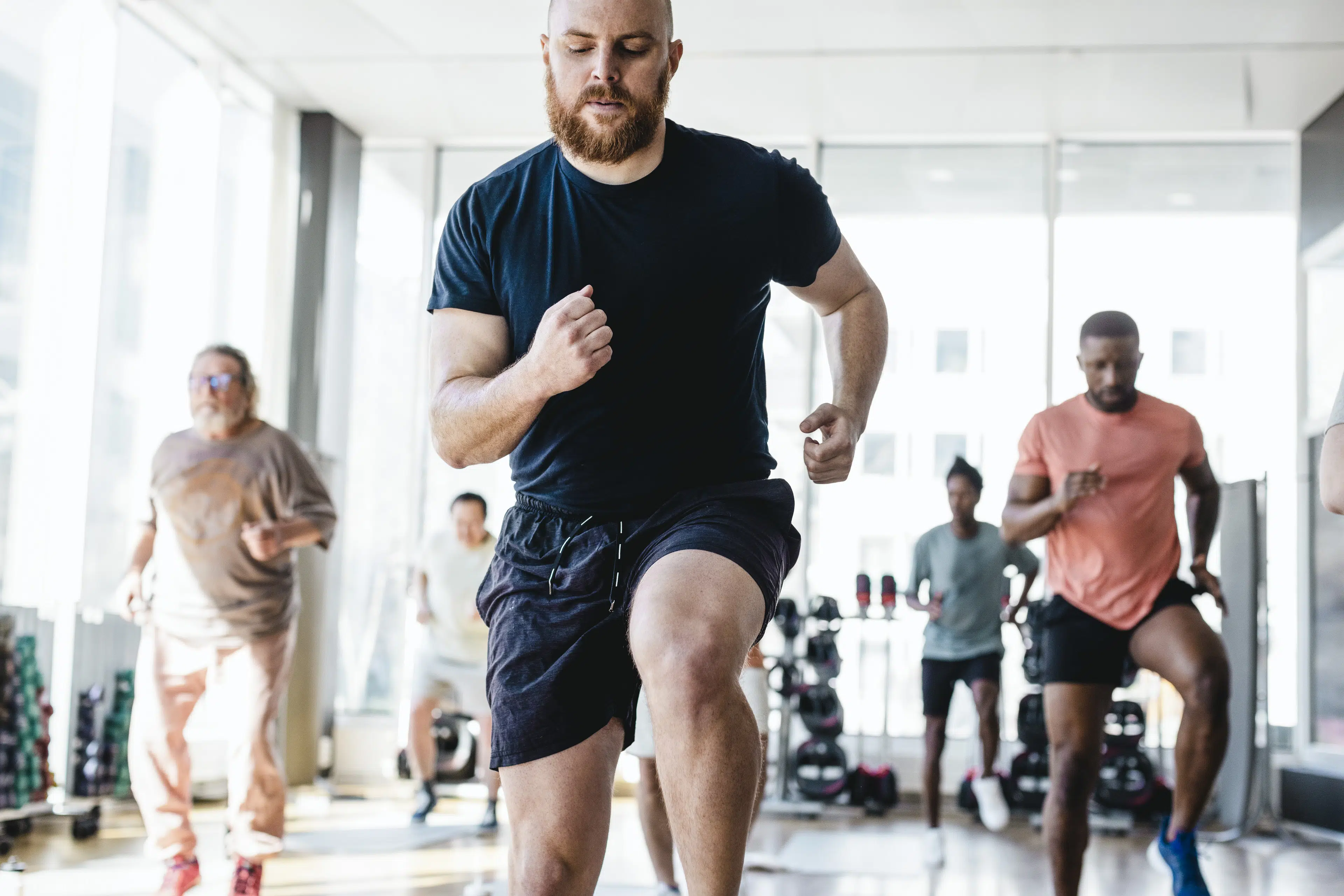 Man doing cardio exercise in a class at the gym