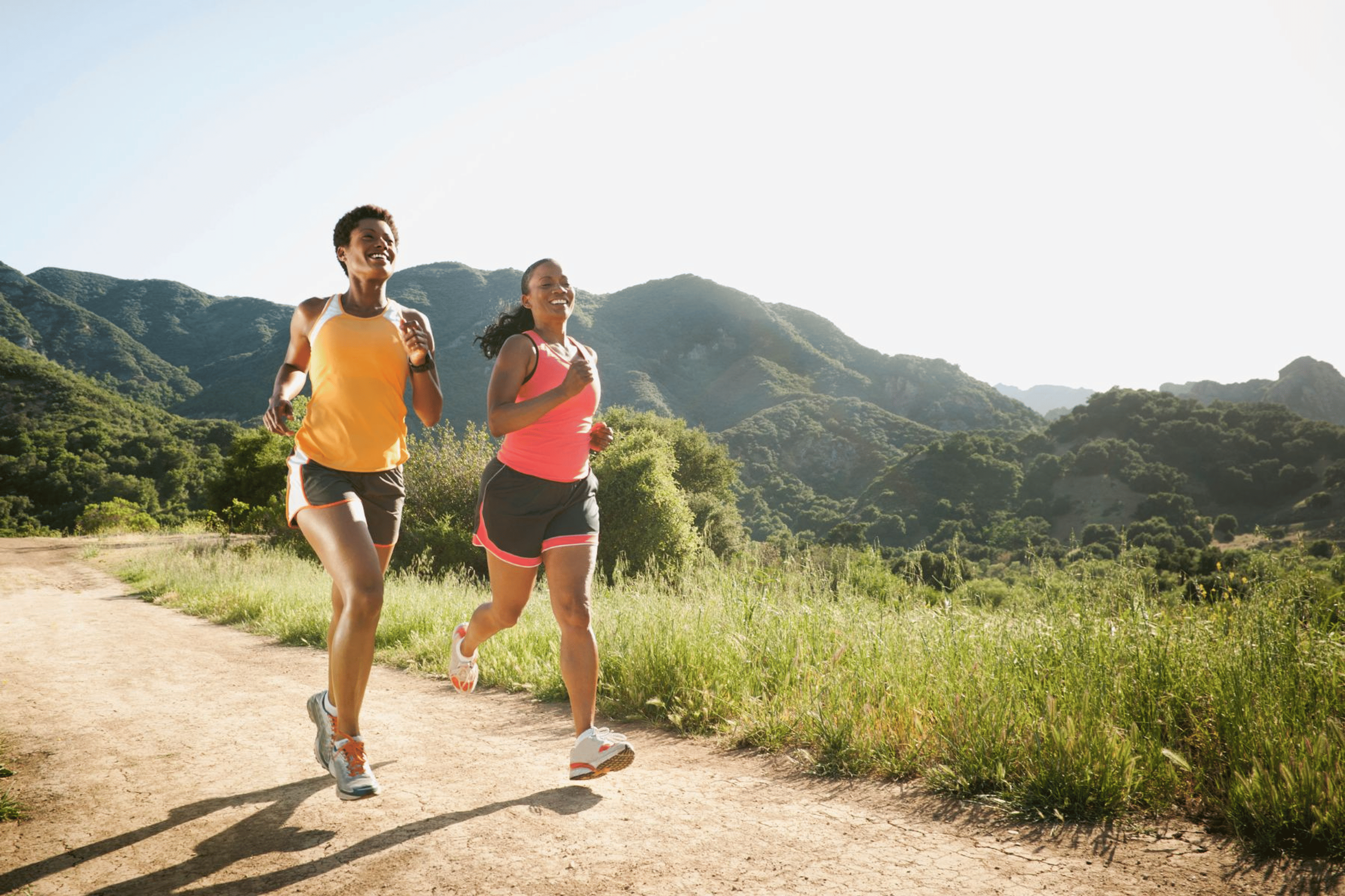 Two women running outside