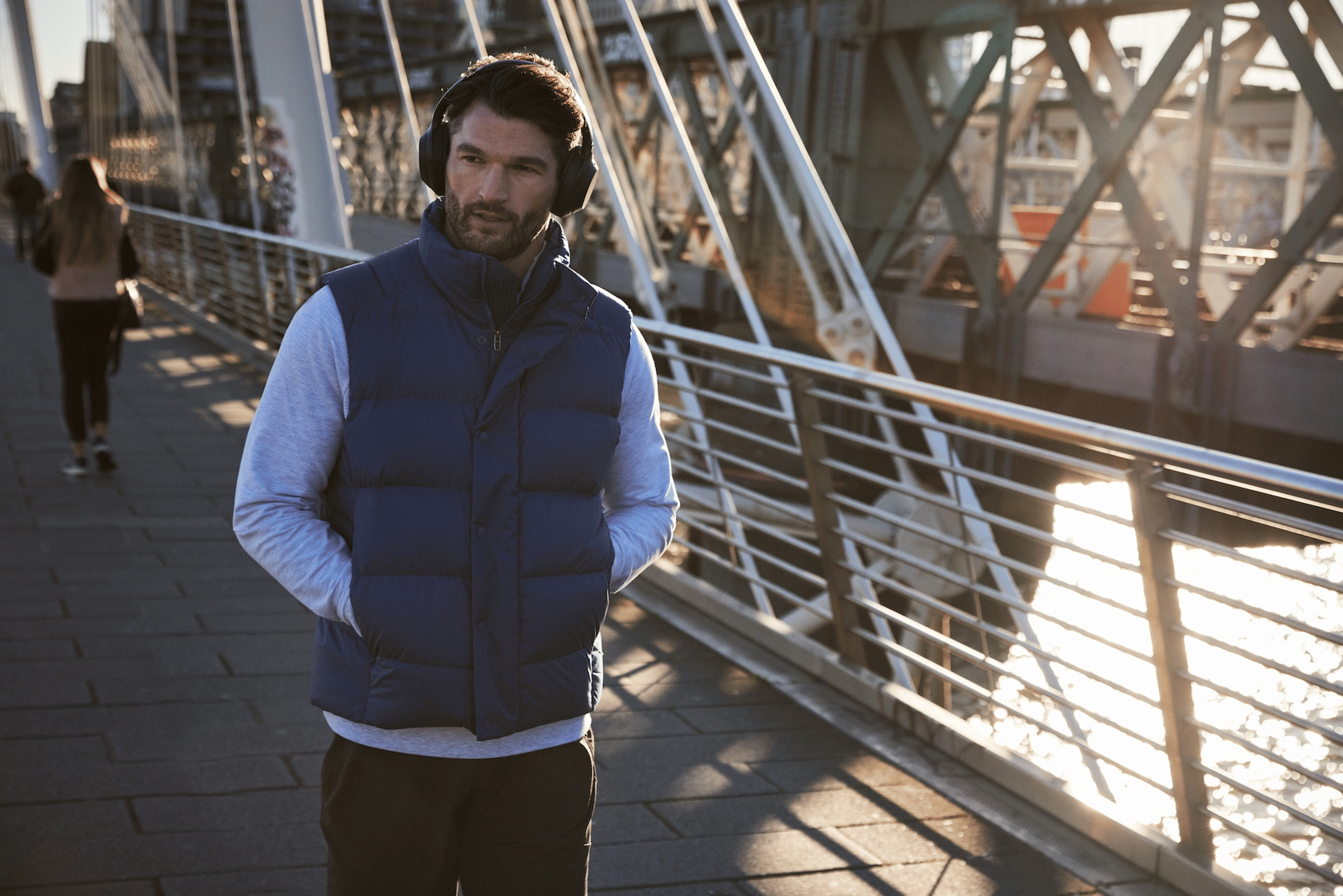 Peloton instructor Jon Hosking walking to commute to work while listening to a meditation on his headphones.