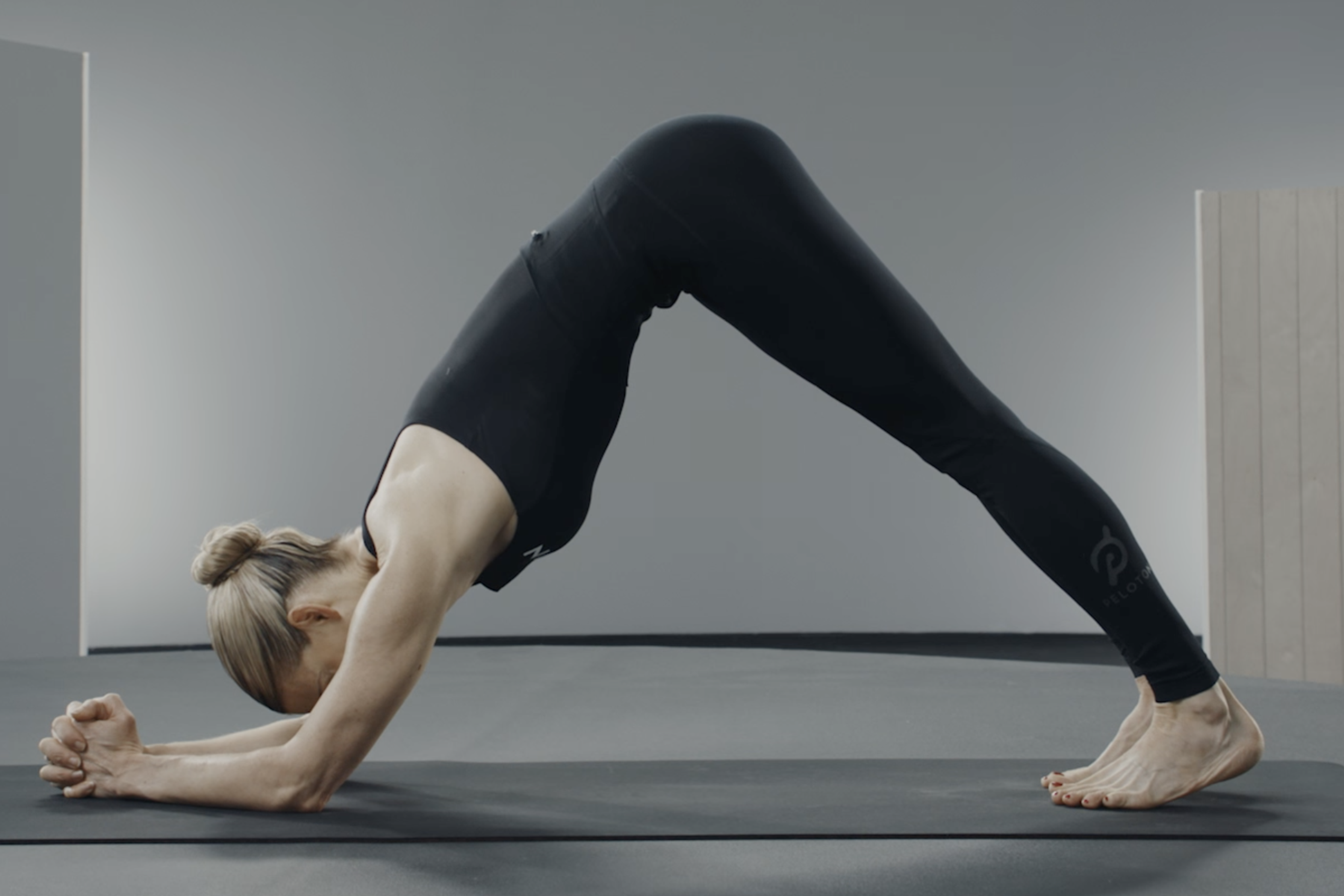 Woman demonstrates Dolphin Pose
