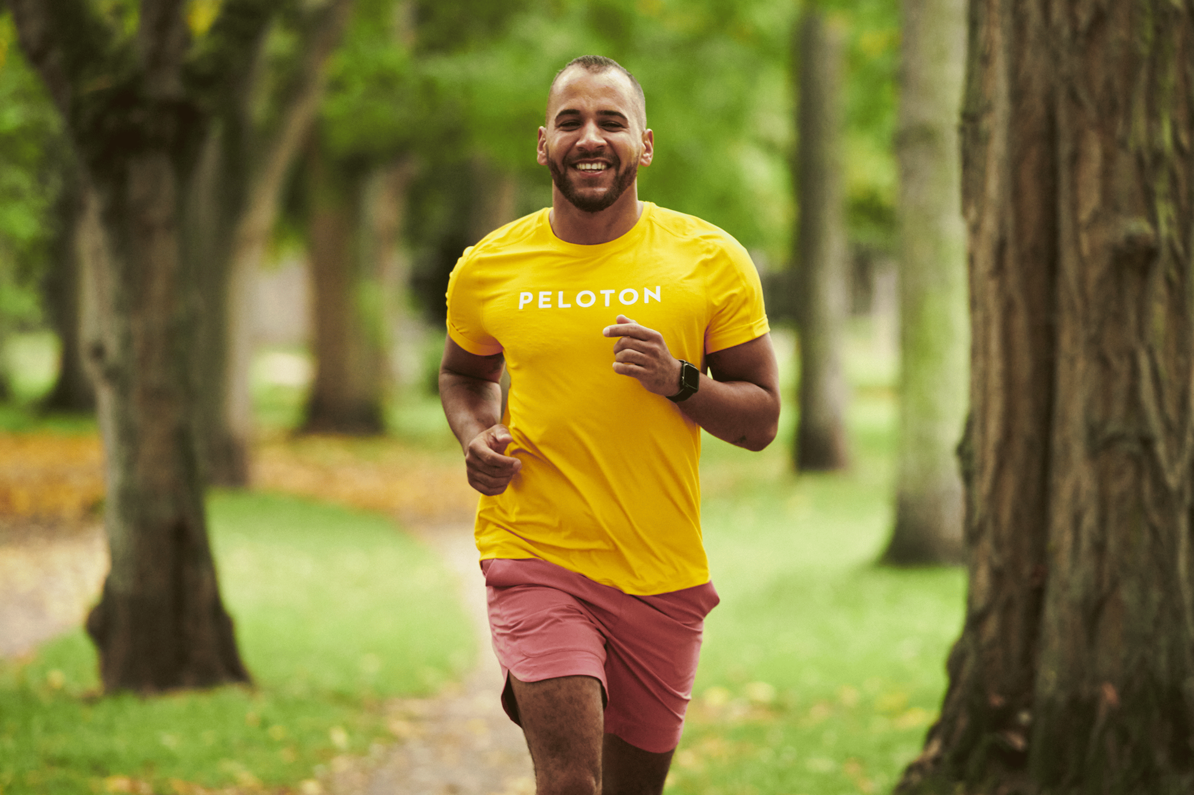 In this photo for an article about mental health routines, Peloton instructor Jeffrey McEachern is smiling and going for run outside.