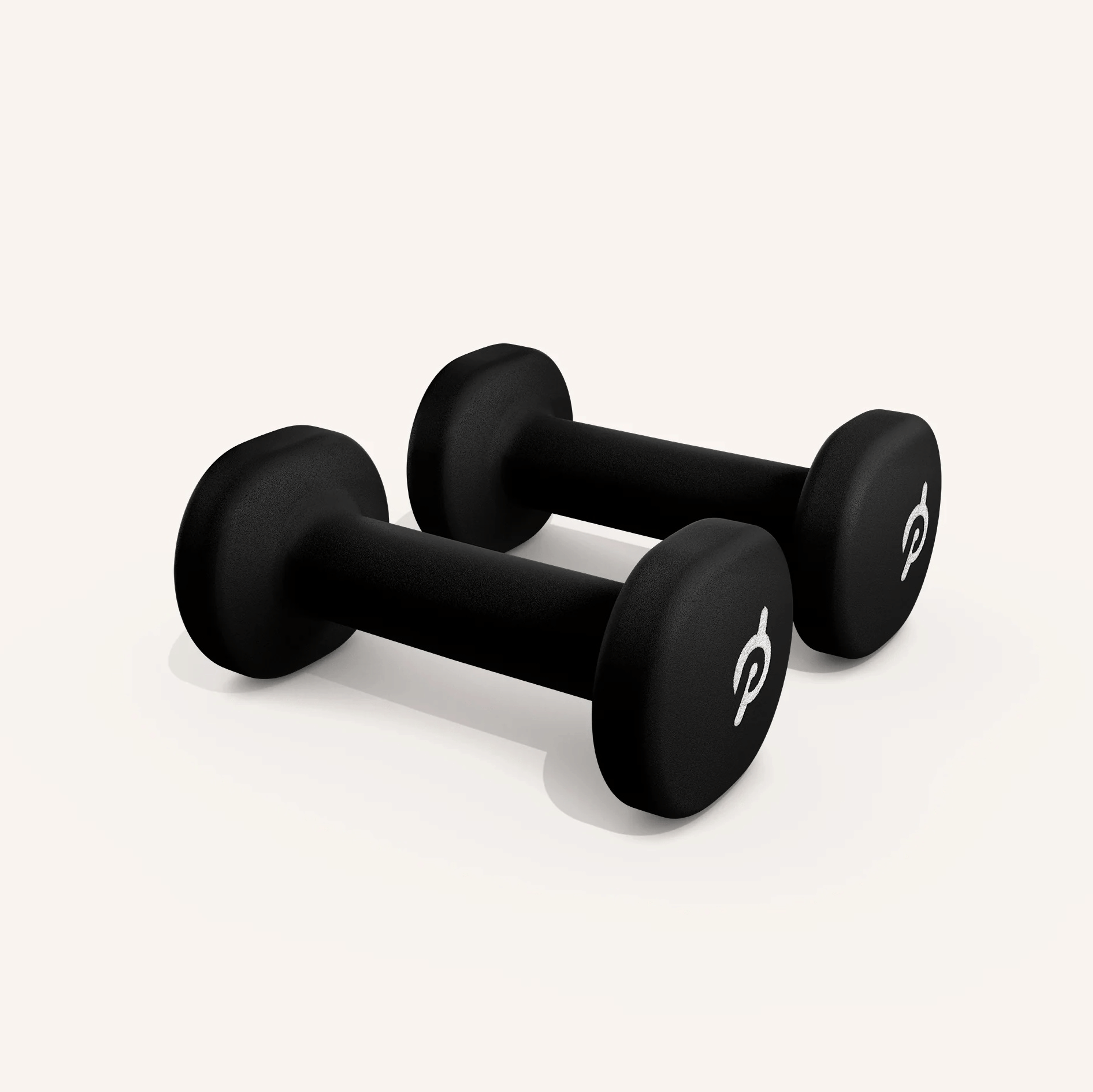 A pair of light Peloton dumbbells as part of a list of Peloton Bike accessories.