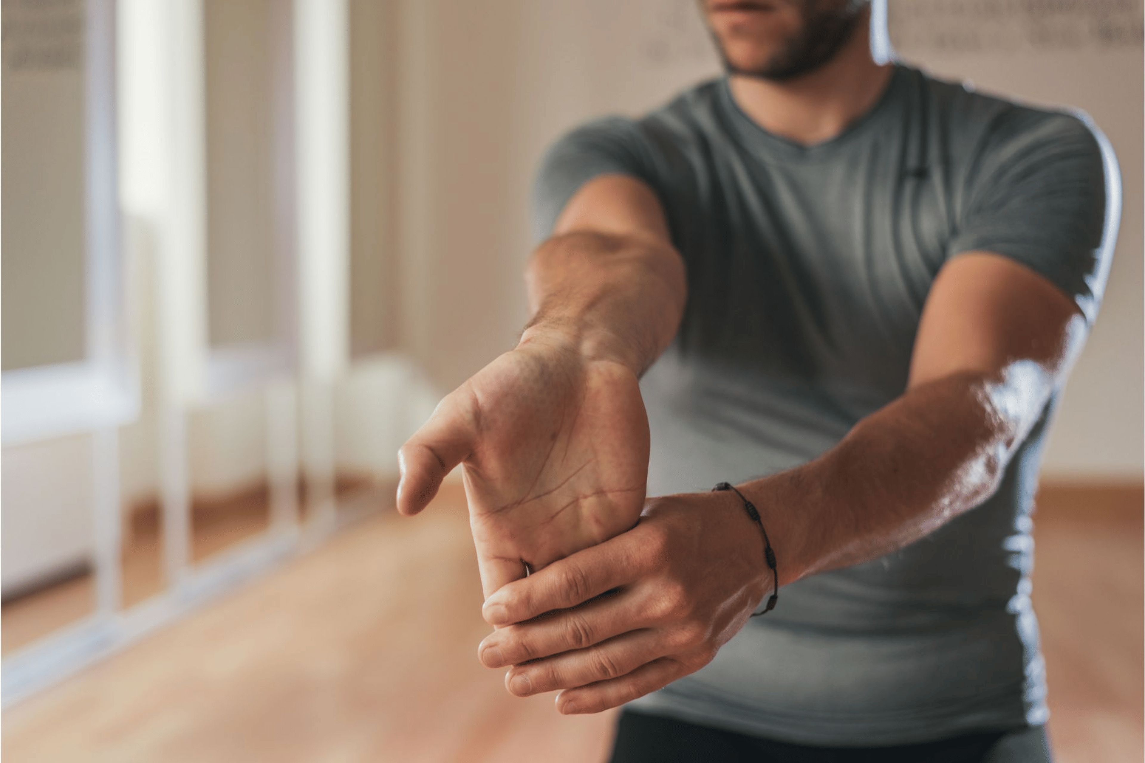 Man doing a wrist flexor stretch