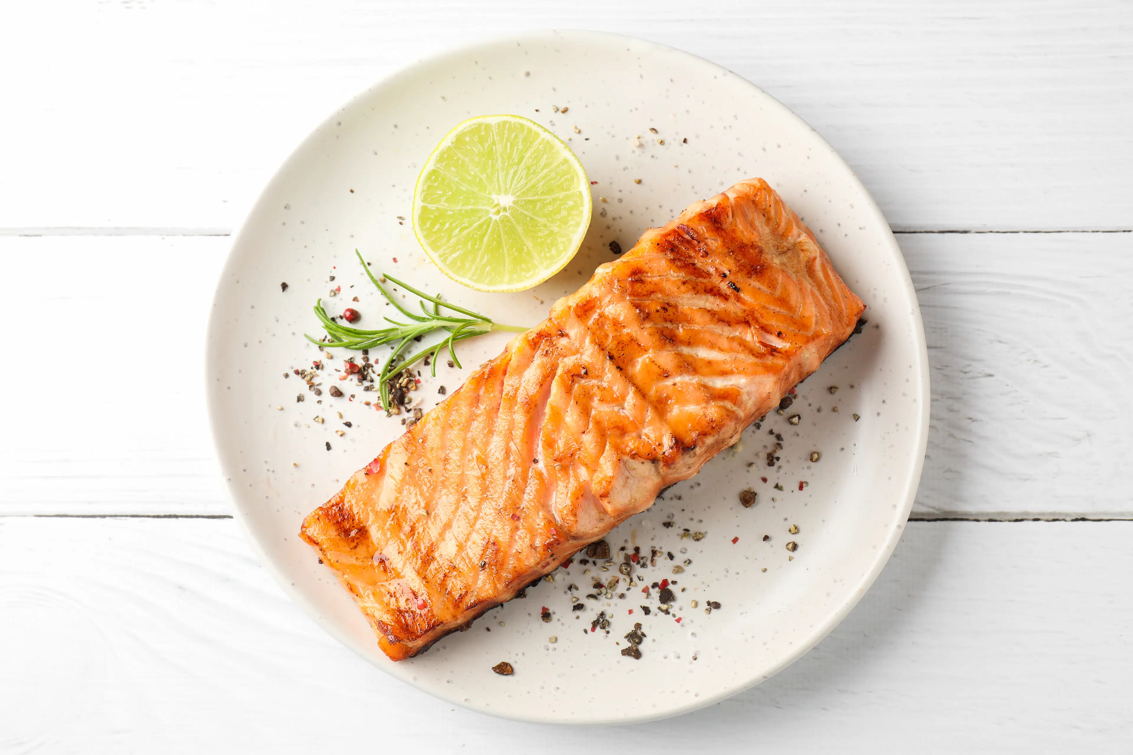 Grilled salmon fillet on a white plate