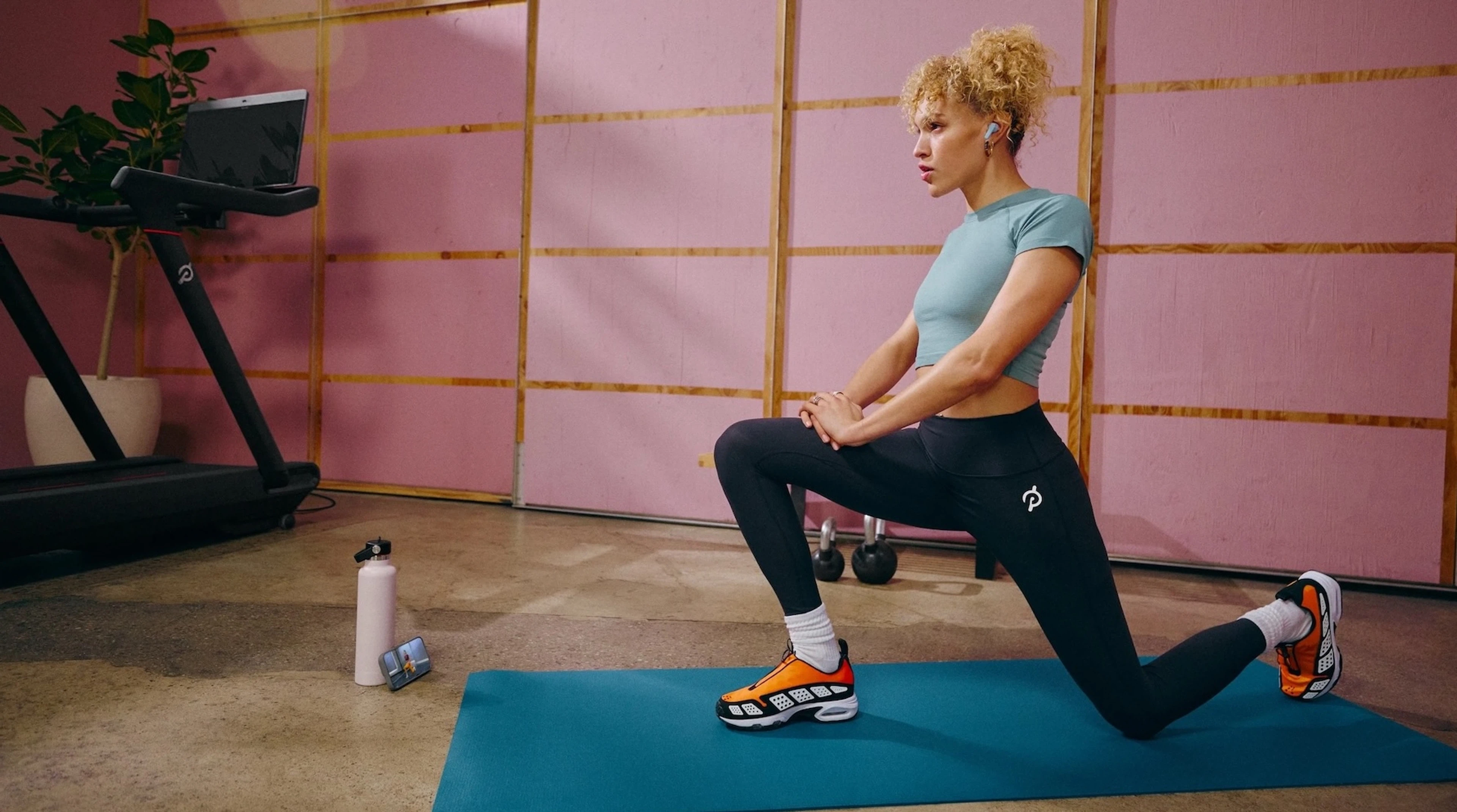 Woman improving her mental health through exercise on Peloton