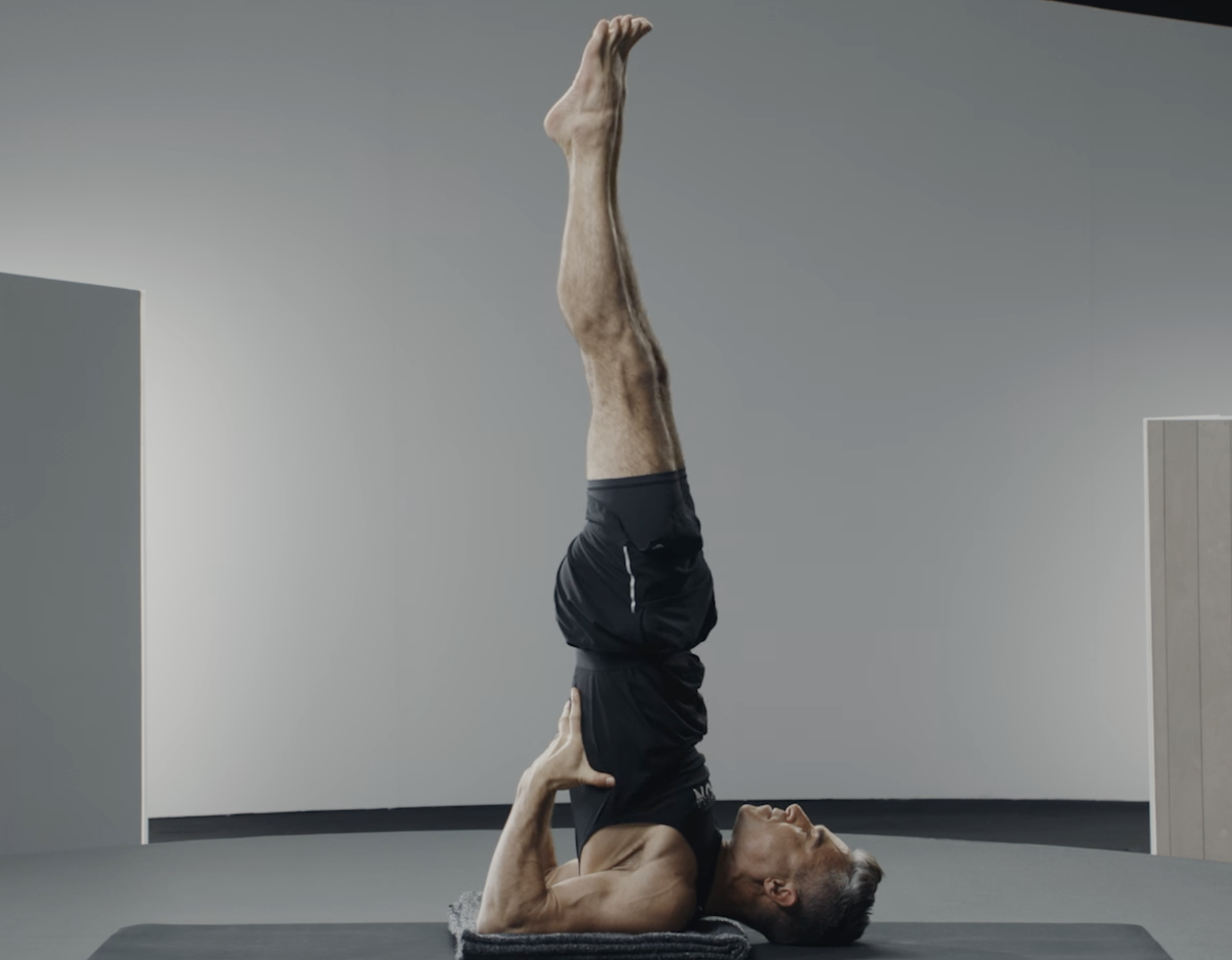 Man does a shoulderstand