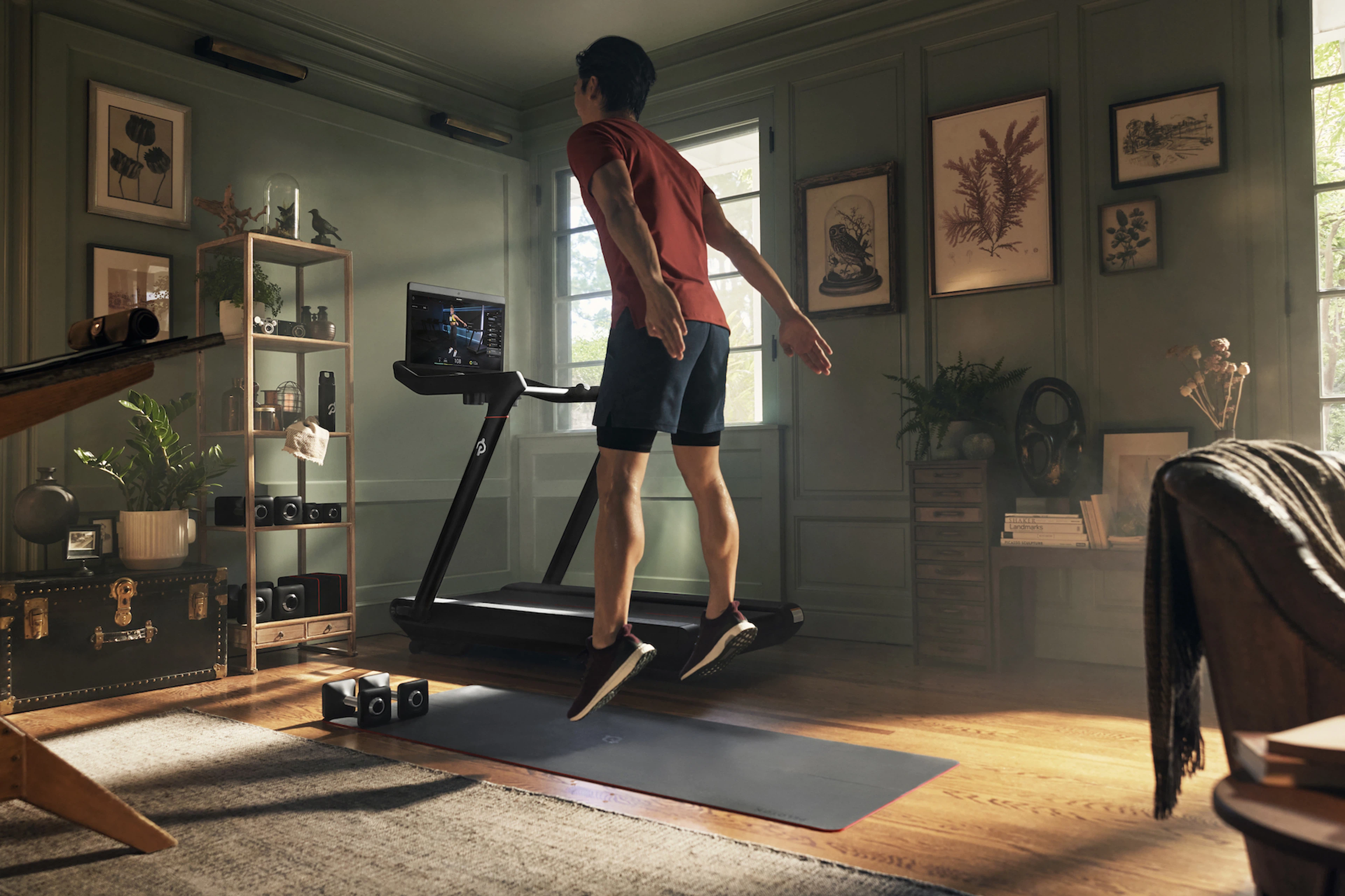 Man works out at home with weights 