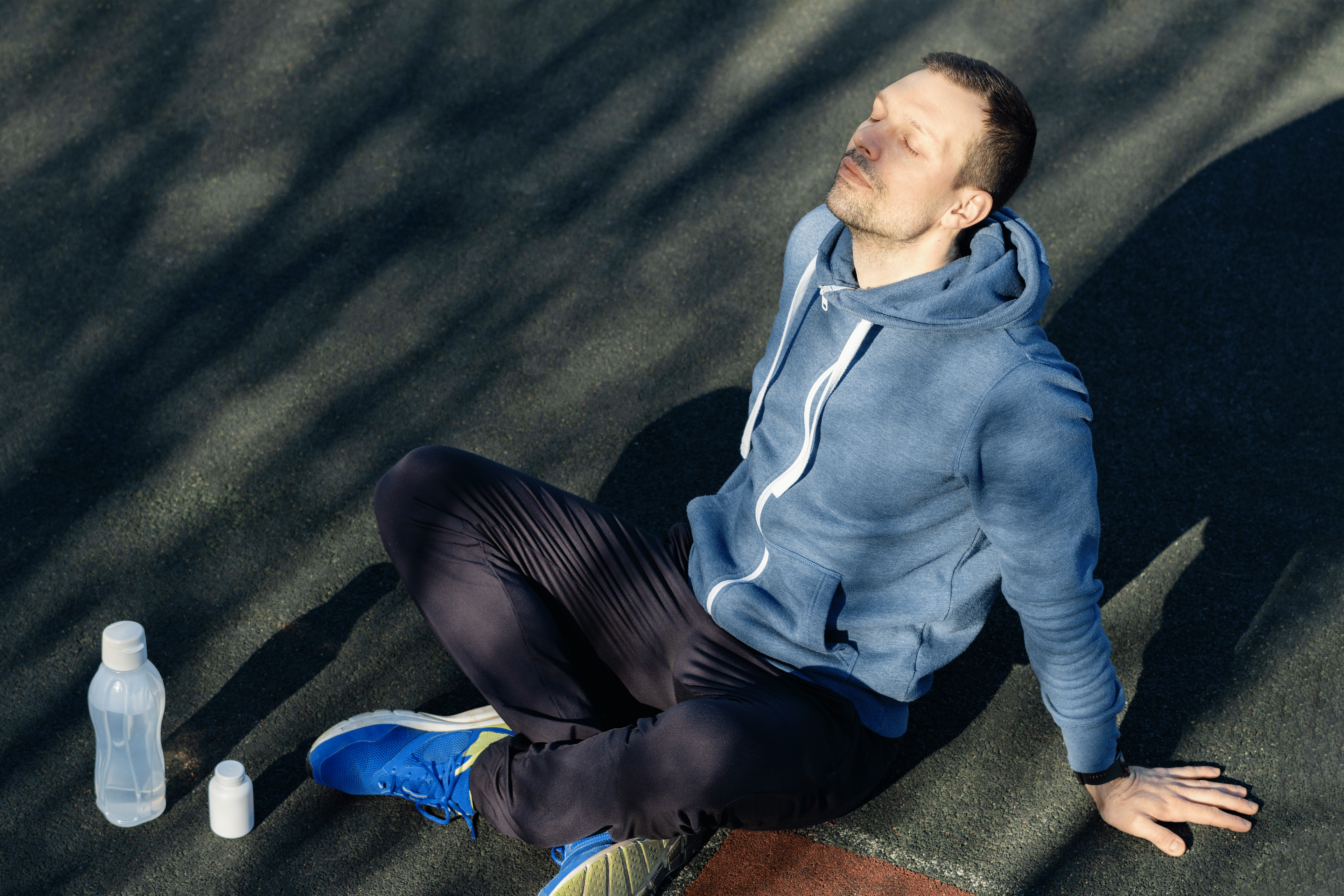 Man meditating on the ground