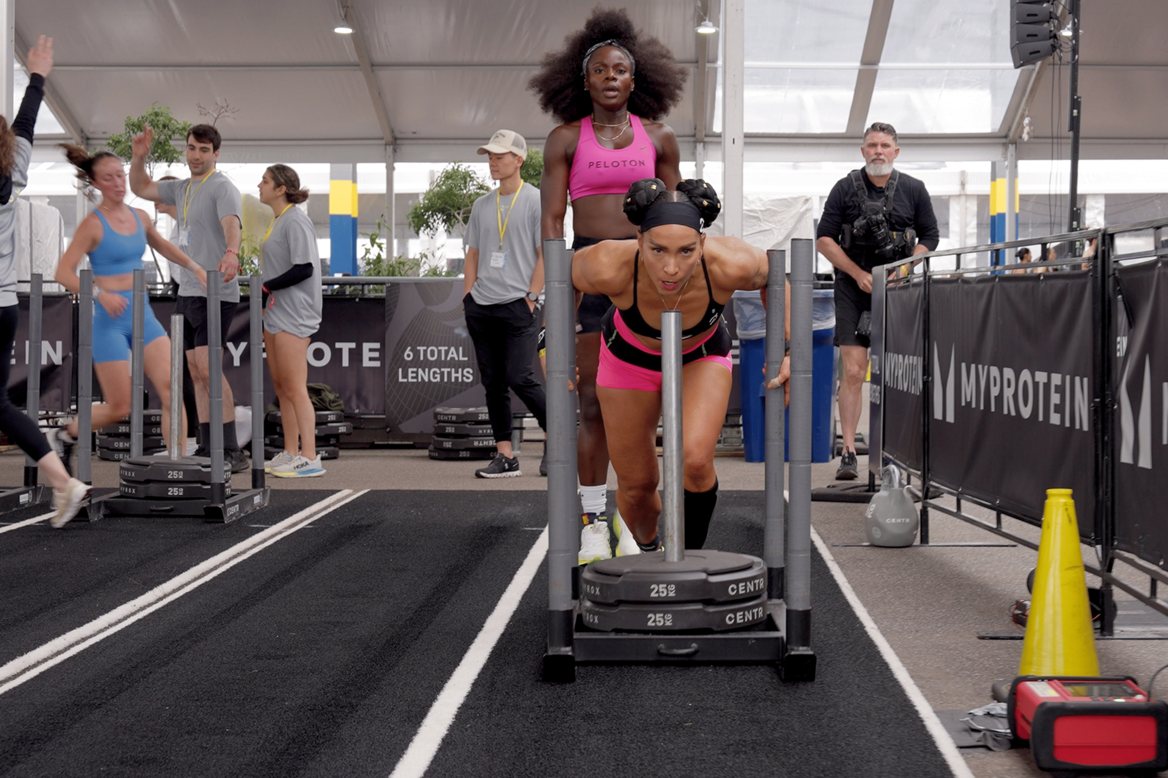 Peloton instructors Robin Arzón and Tunde Oyeneyin competing in HYROX.