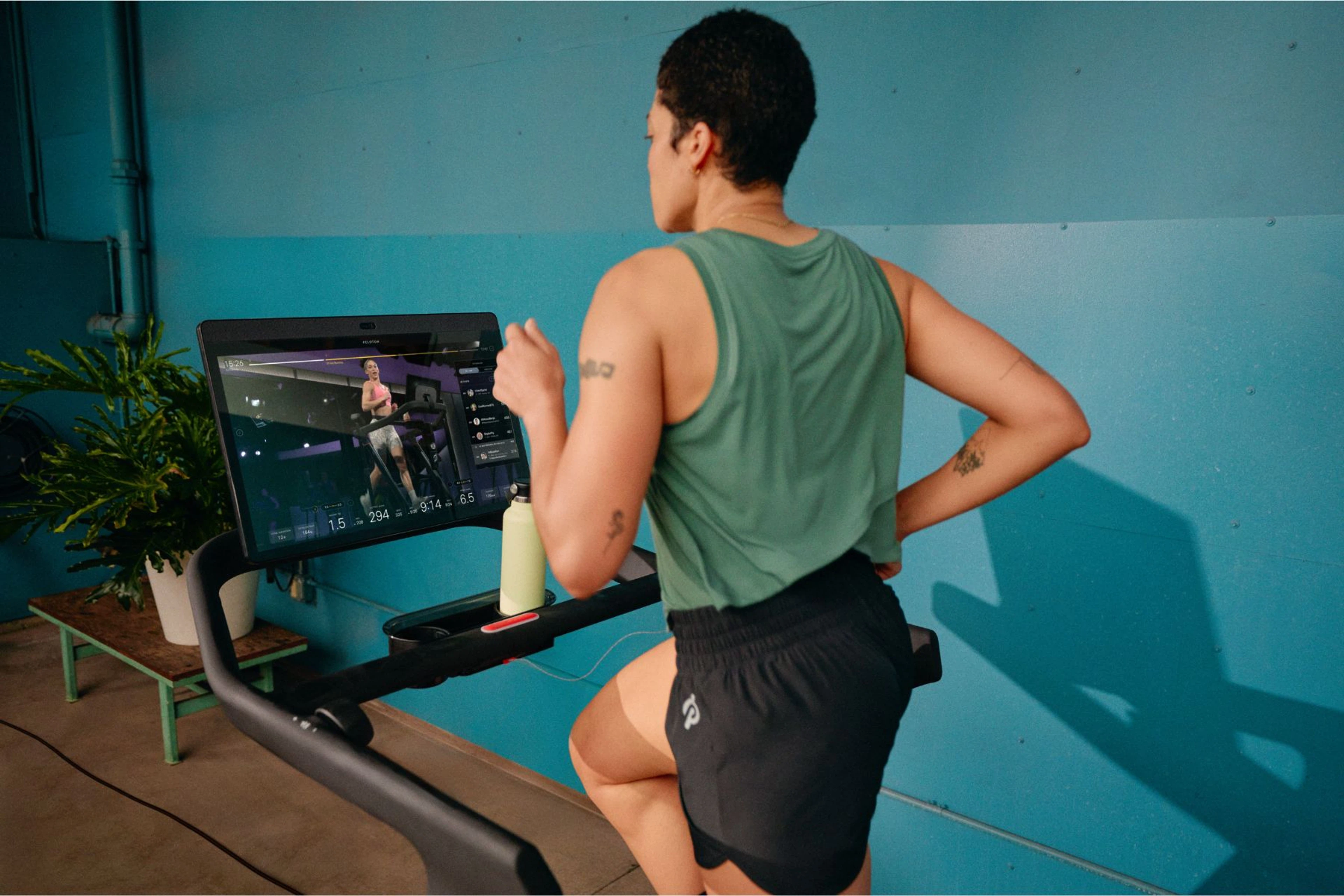 Person running on a Peloton Tread