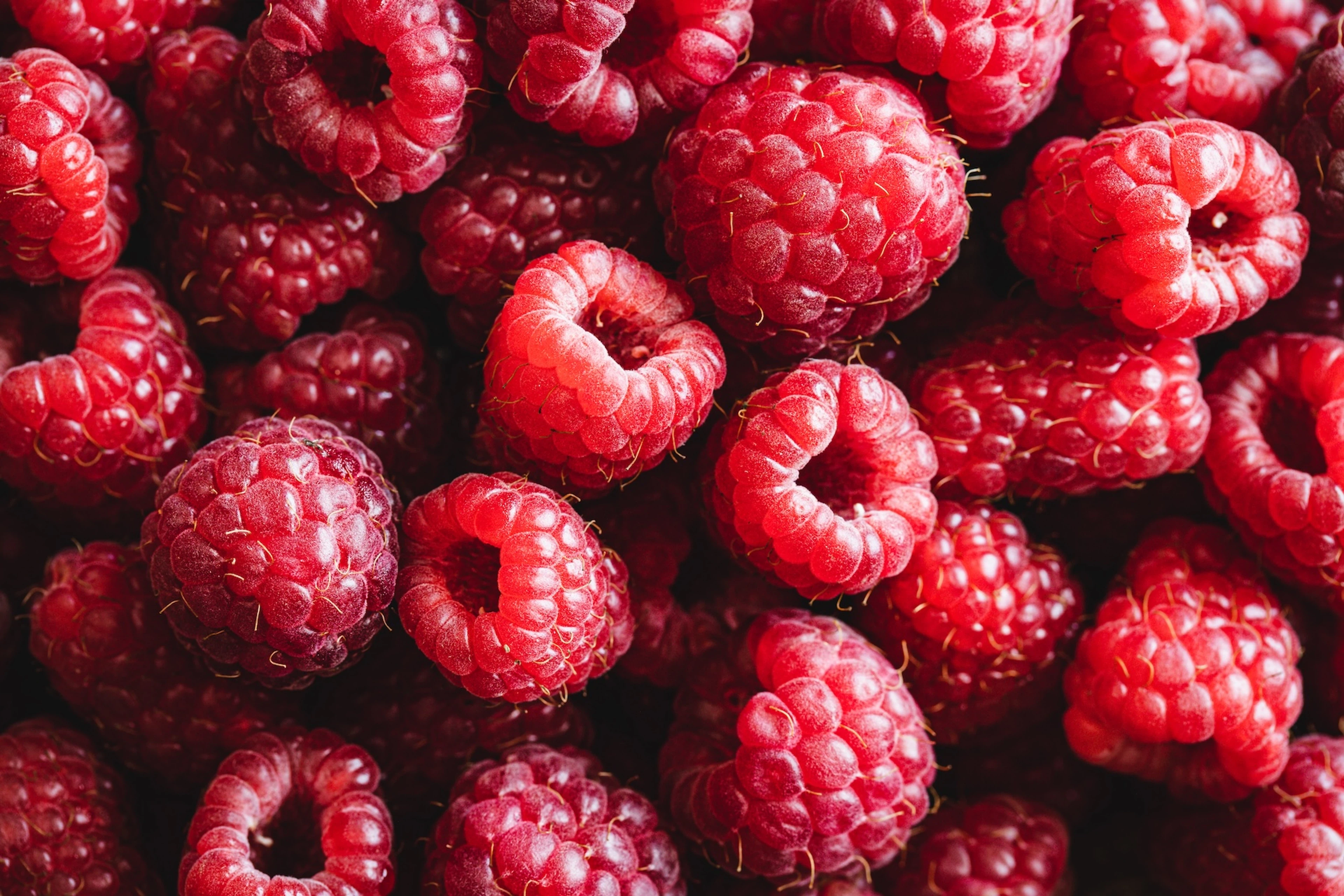 A close-up photo of raspberries.
